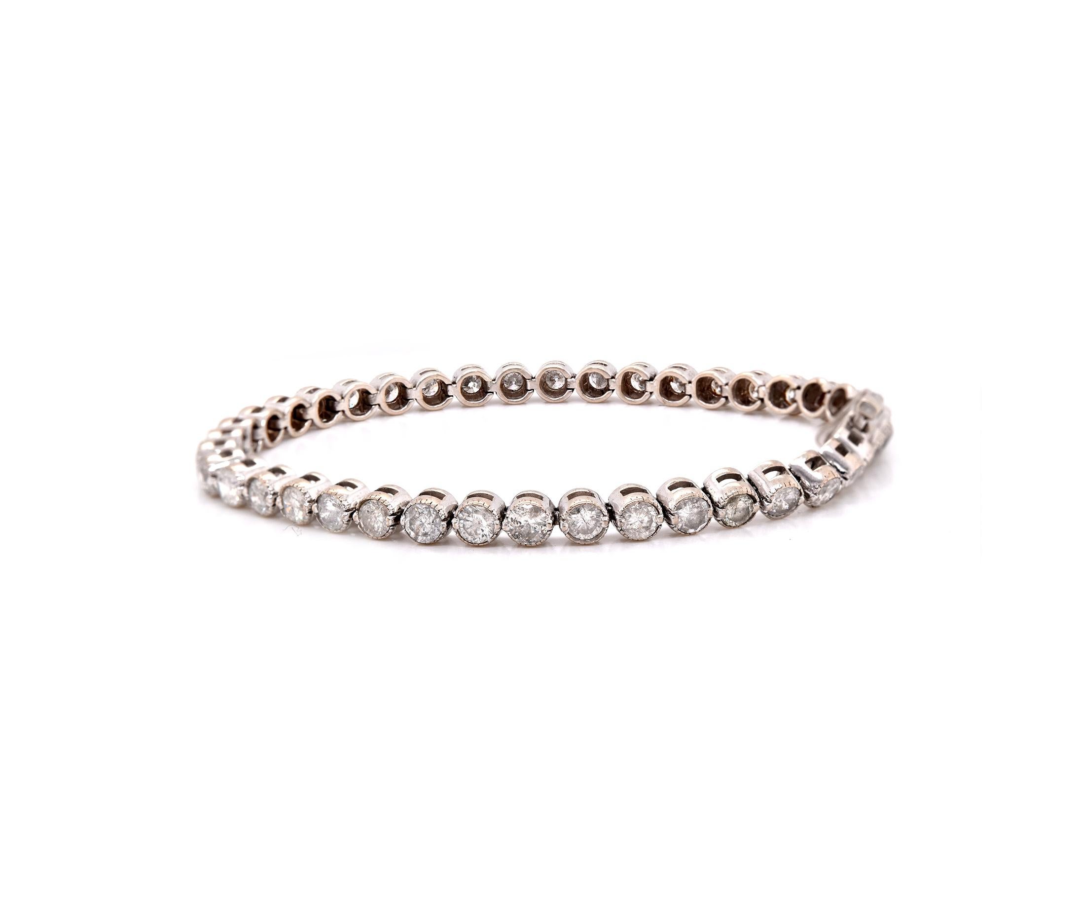 Designer: Custom Designed
Material: 14k white gold
Round Diamonds: 40 round brilliant cuts = 5.00cttw
Color: I
Clarity: SI1-SI2
Dimensions: the bracelet measures 6 ¾  inches in length and 4.10mm in width
Weight: 12.62 grams
