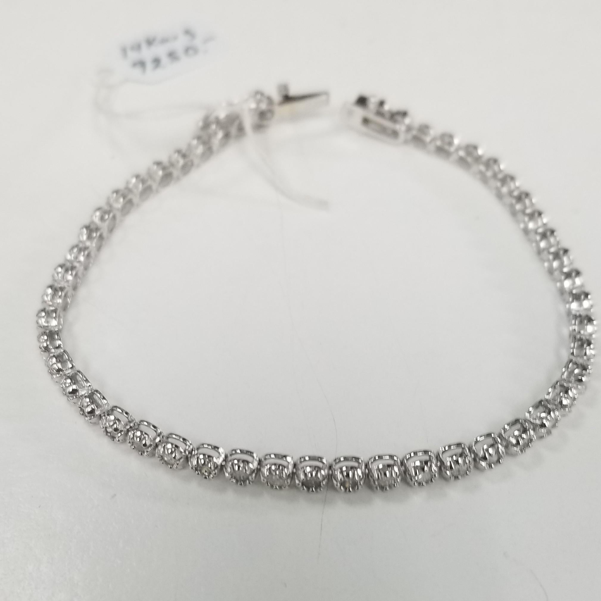 Specifications:
    main stone:ROUND DIAMONDS
    diamonds: 49 PCS
    carat total weight:approximately 3.02 CTW
    color: H-I
    clarity: SI1-SI3
    brand:CUSTOM MADE
    metal:14K white gold
    type:BRACELET
    weight:7.5 gr
    length:7.25