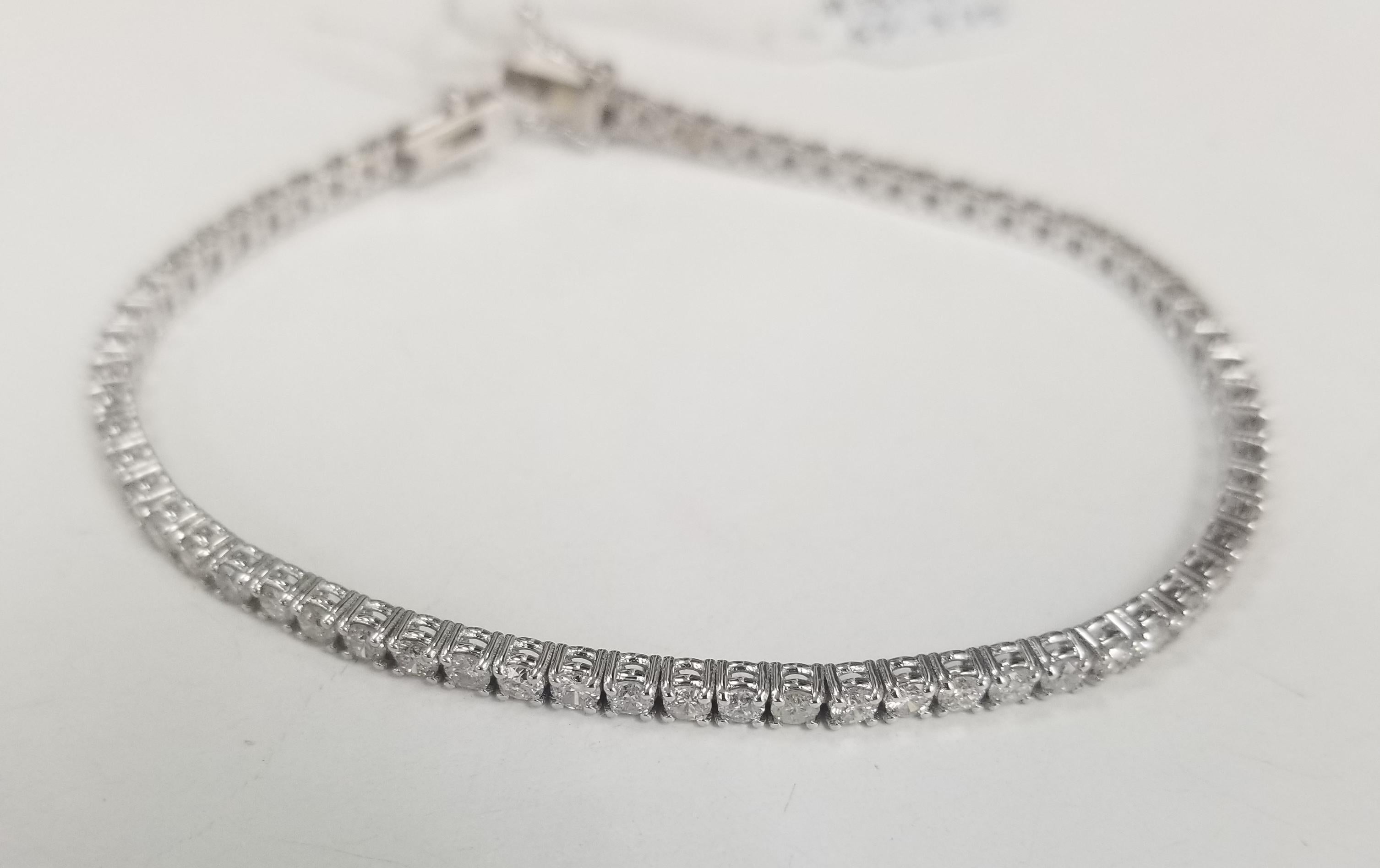 Specifications:
    main stone:ROUND DIAMONDS
    diamonds: 67 PCS
    carat total weight:approximately 3.75 CTW
    color: H-I
    clarity:SI1-2
    brand:CUSTOM MADE
    metal:14K WHITE gold
    type:BRACELET
    weight:8.0 gr
    length:7