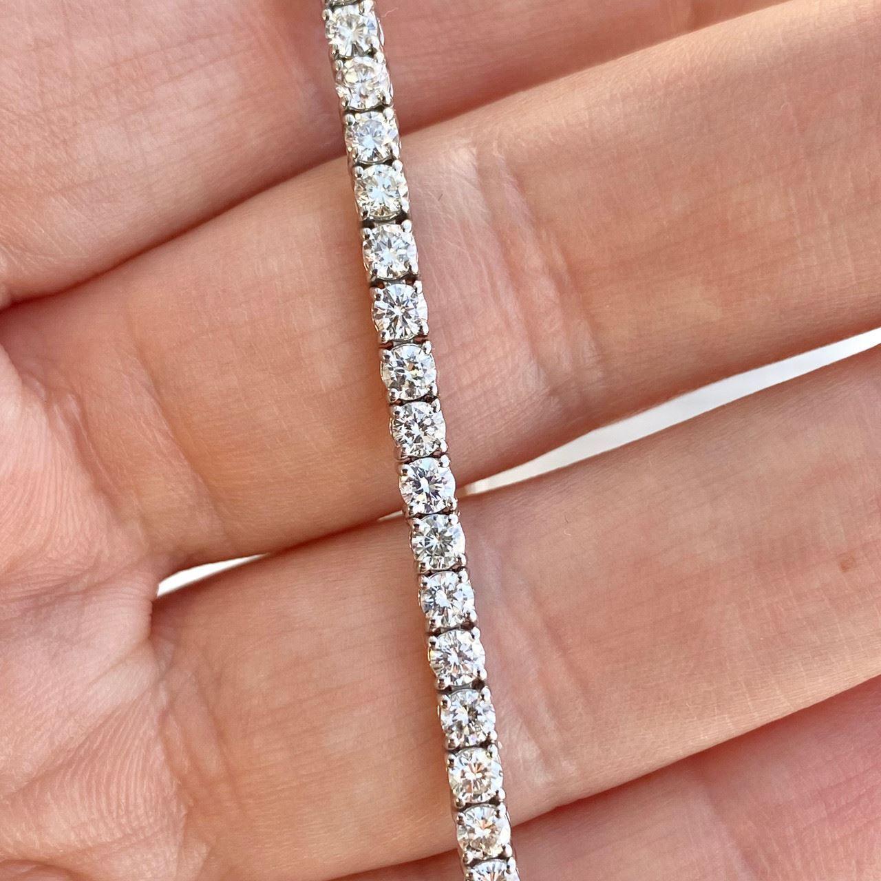 Specifications:
Custom made in Los Angeles, CA
Metal: 18K White Gold
Weight: 8.5 Gr
Main Stone: 3.93ctw Round Diamonds
Color: H
Clarity: VS2-SI1
Size: 7 Inch
Hallmark: ‘750’