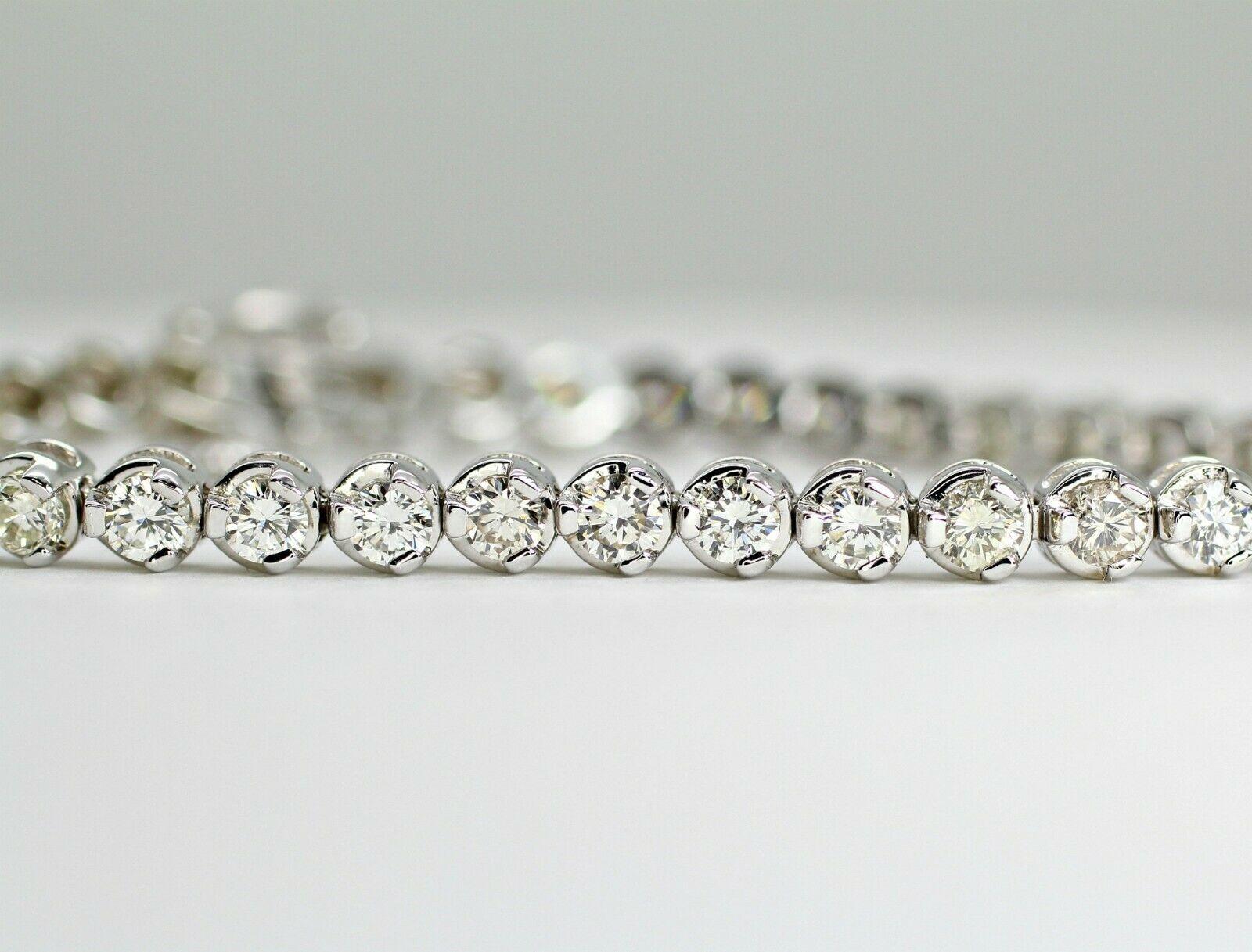 This is a 14k white gold diamond tennis bracelet with approximately 5.32 carat total weight of round diamonds. The diamonds range from H-J color, VS2-Si1 clarity. The round diamonds are brilliant and clean with no visible inclusions. It is not too