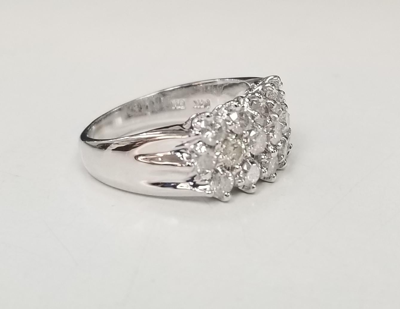 14k white gold diamond wedding ring 
Specifications:
    main stone: BRILLIANT CUT DIAMOND
    diamonds: 16 PIECES
    carat total weight: 1.17
    color: H
    clarity: SI2-I1 
    metal: white gold
    width: 3mm
    type: ring
    size: 6.25 US 