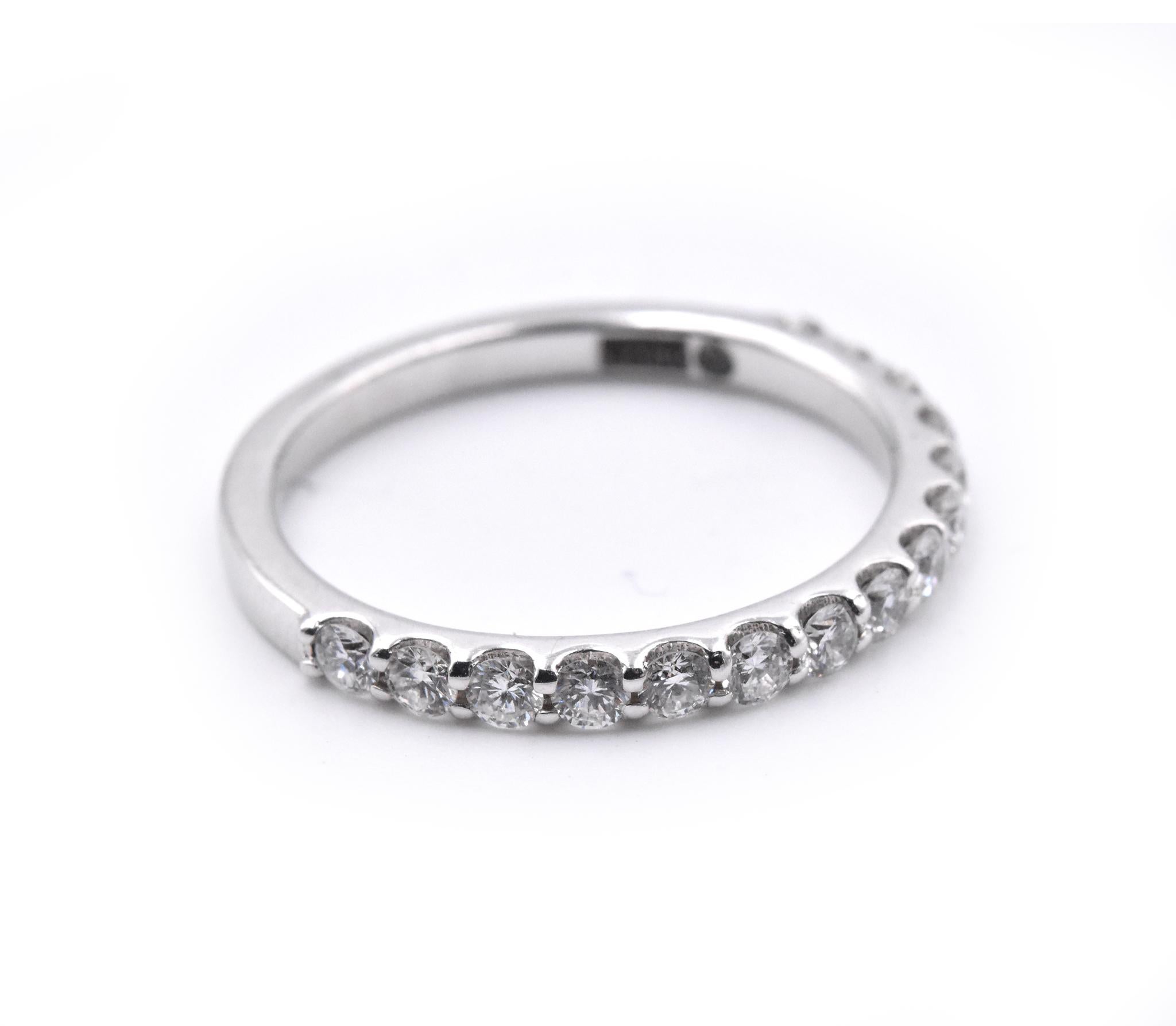 Designer: custom
Material: 14k white gold
Diamonds: 15 round brilliant cuts = 0.55cttw
Size: 6 ¾ (please allow two additional shipping days for sizing requests)  
Dimensions: ring measures 1.95mm in width
Weight: 2.20 grams
