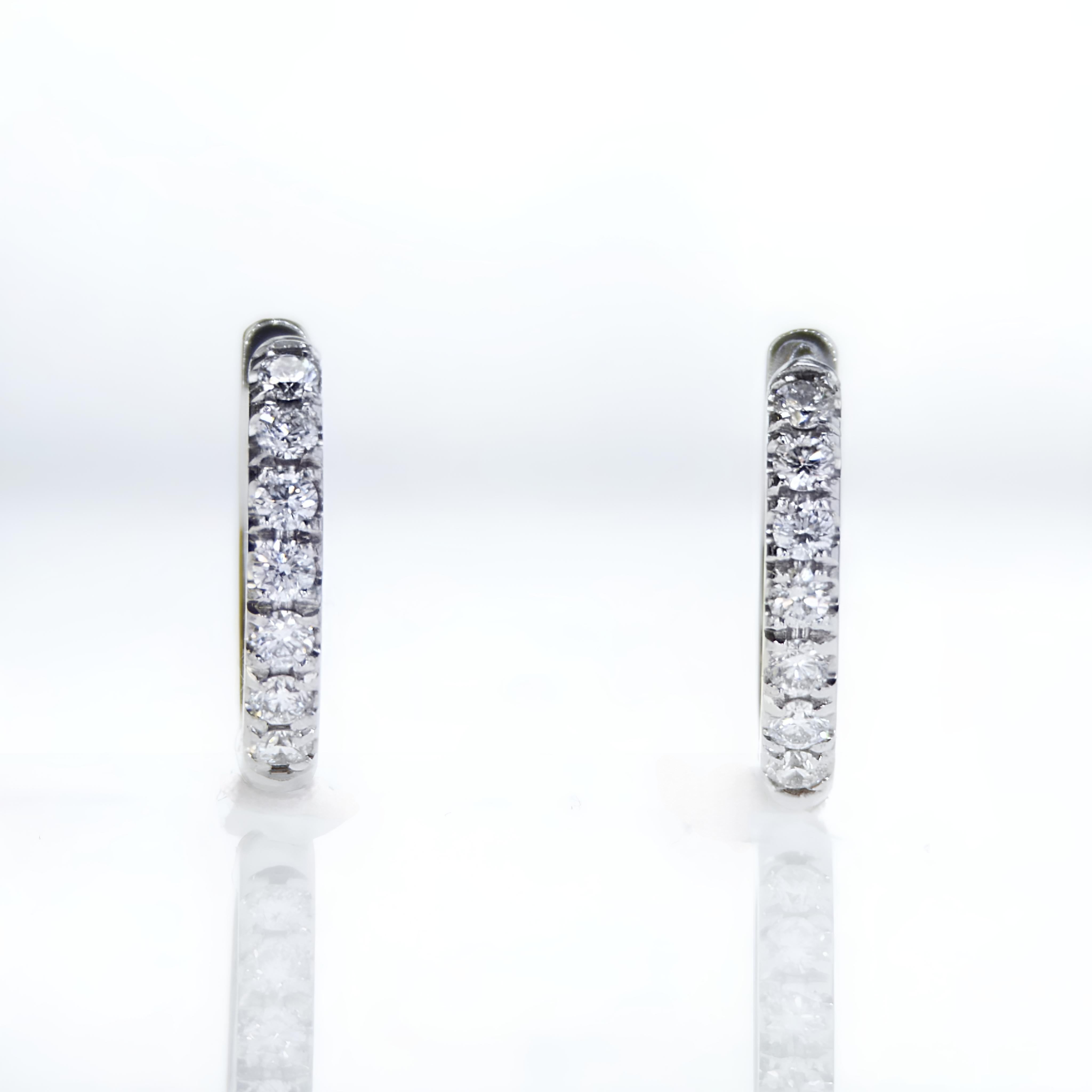 14K White Gold 0.28Ct Diamonds Hoop Earrings

Product Description:

Introducing our White Gold Diamonds Hoop Earrings, an exquisite creation that redefines elegance. Crafted with precision, this pair of hoop earrings features a total of 0.28Ct