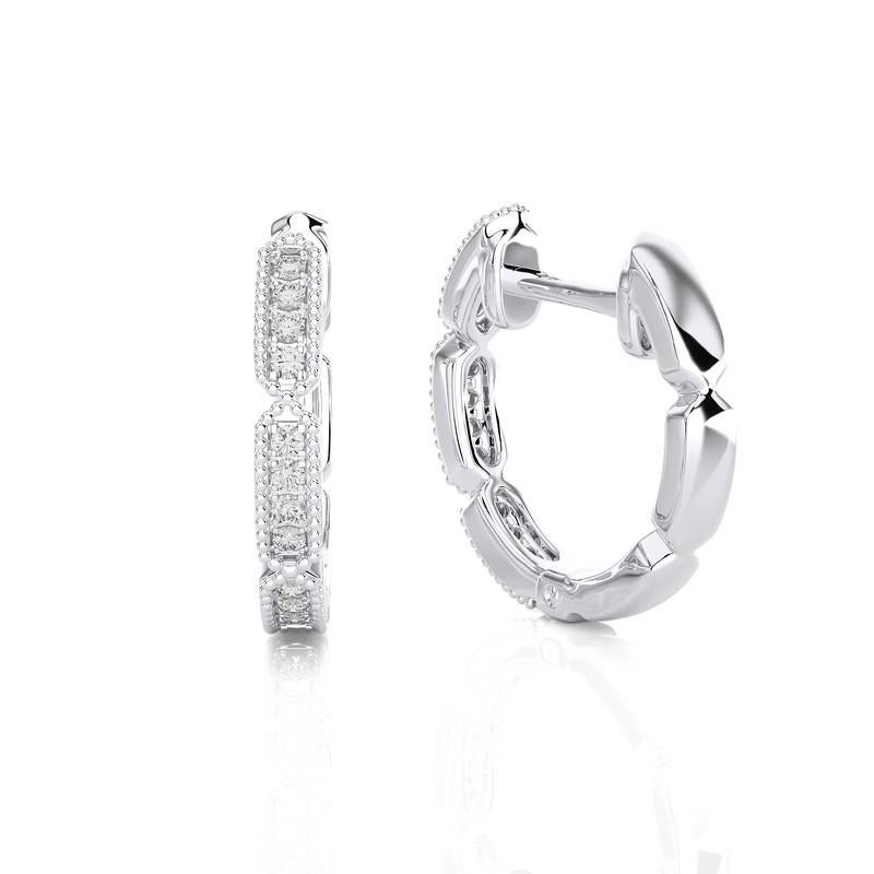 Indulge in understated luxury with our 14K White Gold Diamonds Huggie Earrings, each adorned with 24 dazzling diamonds totaling 0.12 carats. These elegant huggie earrings embrace your earlobes in a modern design, blending comfort with
