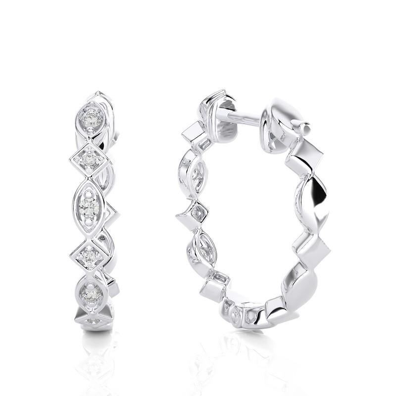 Elevate your style with our 14K White Gold Diamonds Huggie Earring, featuring a delicate 0.13 CTW of brilliant diamonds. Crafted in the warm embrace of white gold, this earring exudes timeless charm and modern sophistication. Its huggie design