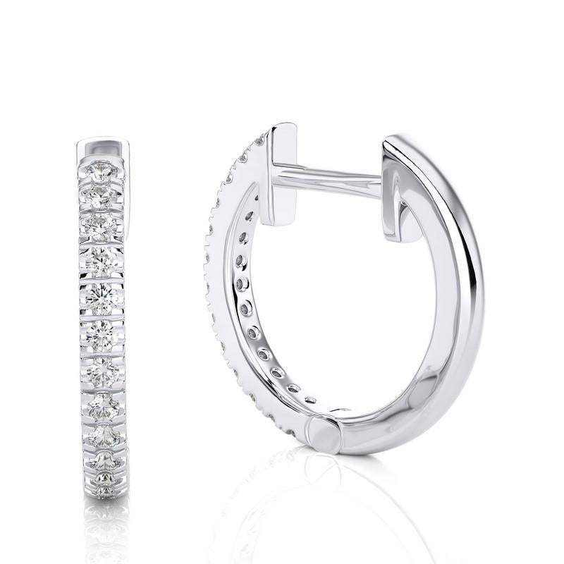 Revel in the exquisite fusion of classic charm and contemporary innovation with our 14K White Gold Diamonds Hoops and Huggie Earring. This exceptional piece seamlessly blends the timeless elegance of hoops with the snug comfort of huggies, adorned