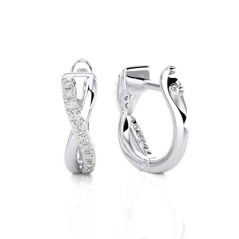 14K White Gold Diamonds Huggie Earring -0.18 CTW
A symbol of pure elegance and brilliance. This exquisite huggie earring, crafted in pristine white gold, is adorned with a total of 0.18 carats of dazzling diamonds. Its sleek design and radiant gems
