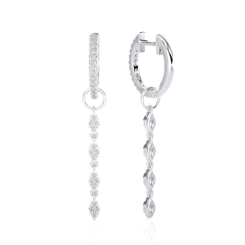 Elevate your style with our 14K White Gold Diamonds Huggie Earrings, adorned with an impressive total of 0.37 carats across 58 dazzling diamonds. These huggie earrings seamlessly blend classic charm with contemporary sophistication.

Crafted from