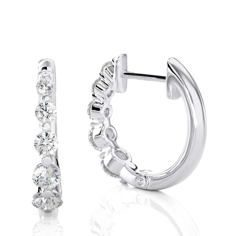 Elevate your jewelry collection with our 14K White Gold Diamonds Huggie Earrings, featuring a total of 0.45 carats and adorned with ten exquisite diamonds. These huggie earrings combine classic elegance with a touch of contemporary flair.

Crafted