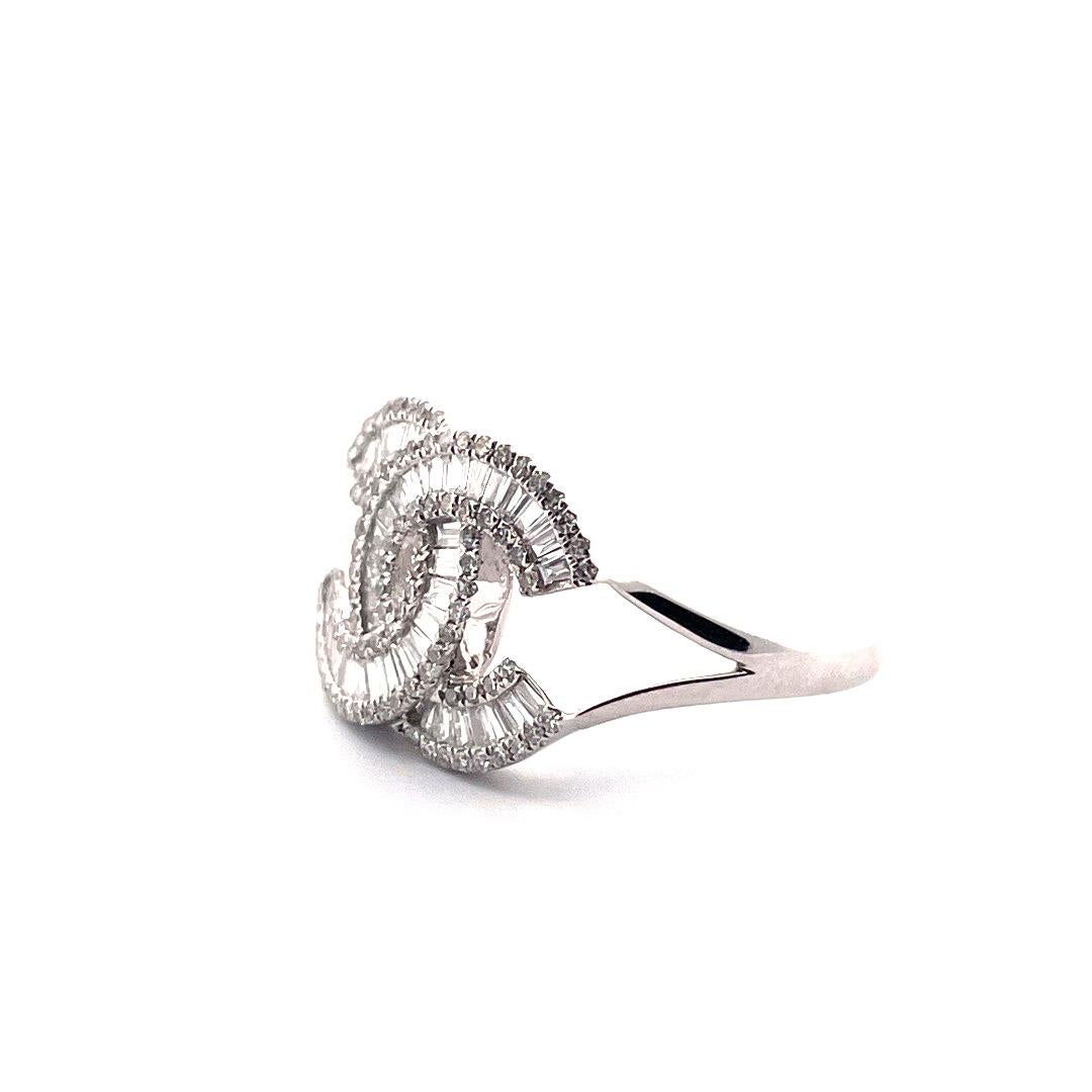 14K White Gold Snake Diamond Ring 

This stunning ring is crafted from 14K white gold and features a stylish double CC design. The ring is further enhanced by 0.47TCW diamonds, adding a touch of sparkle and luxury. Weighing in at 3.3 grams, this