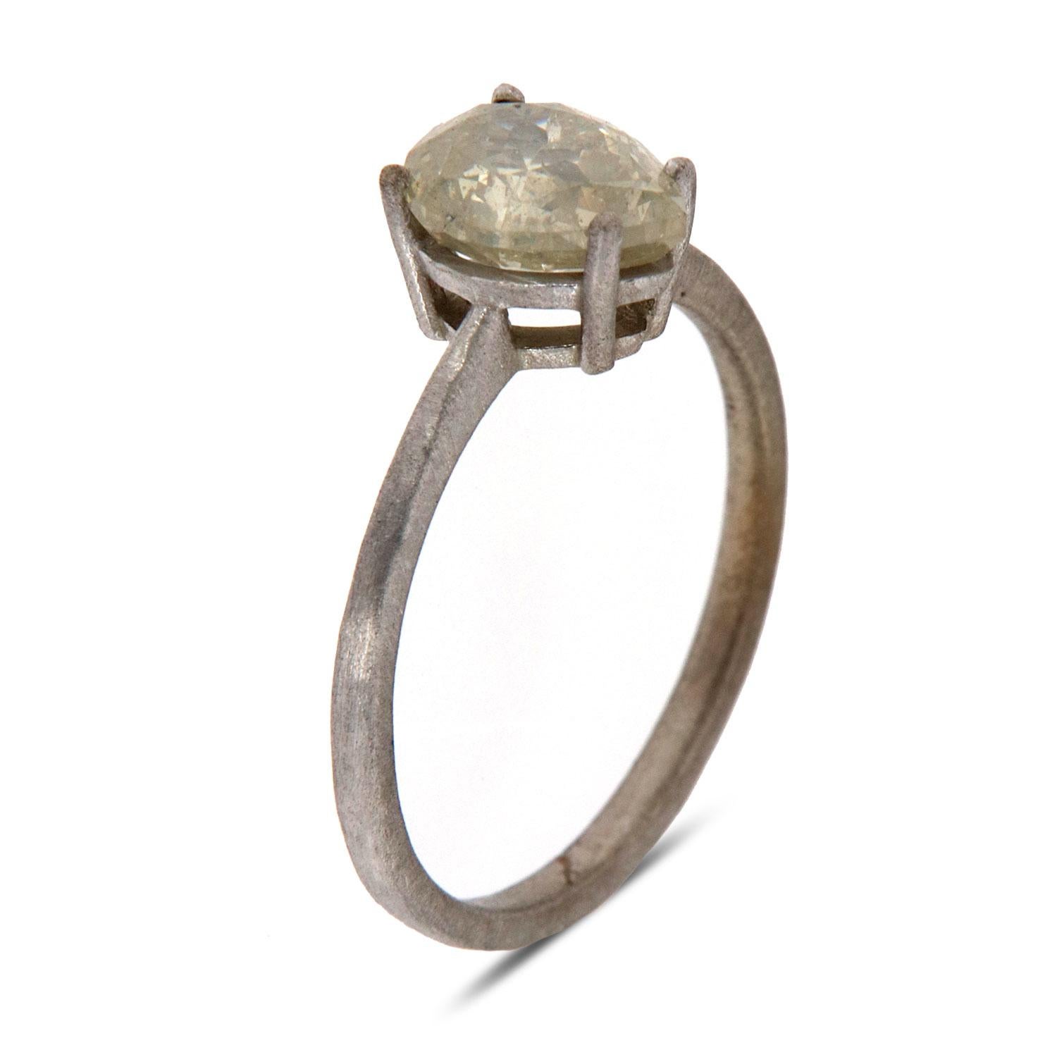 This Earthy design solitaire ring features a 1.35 -Carat 