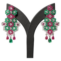 14K white gold earrings adorned with emeralds, rubies, and white sapphires