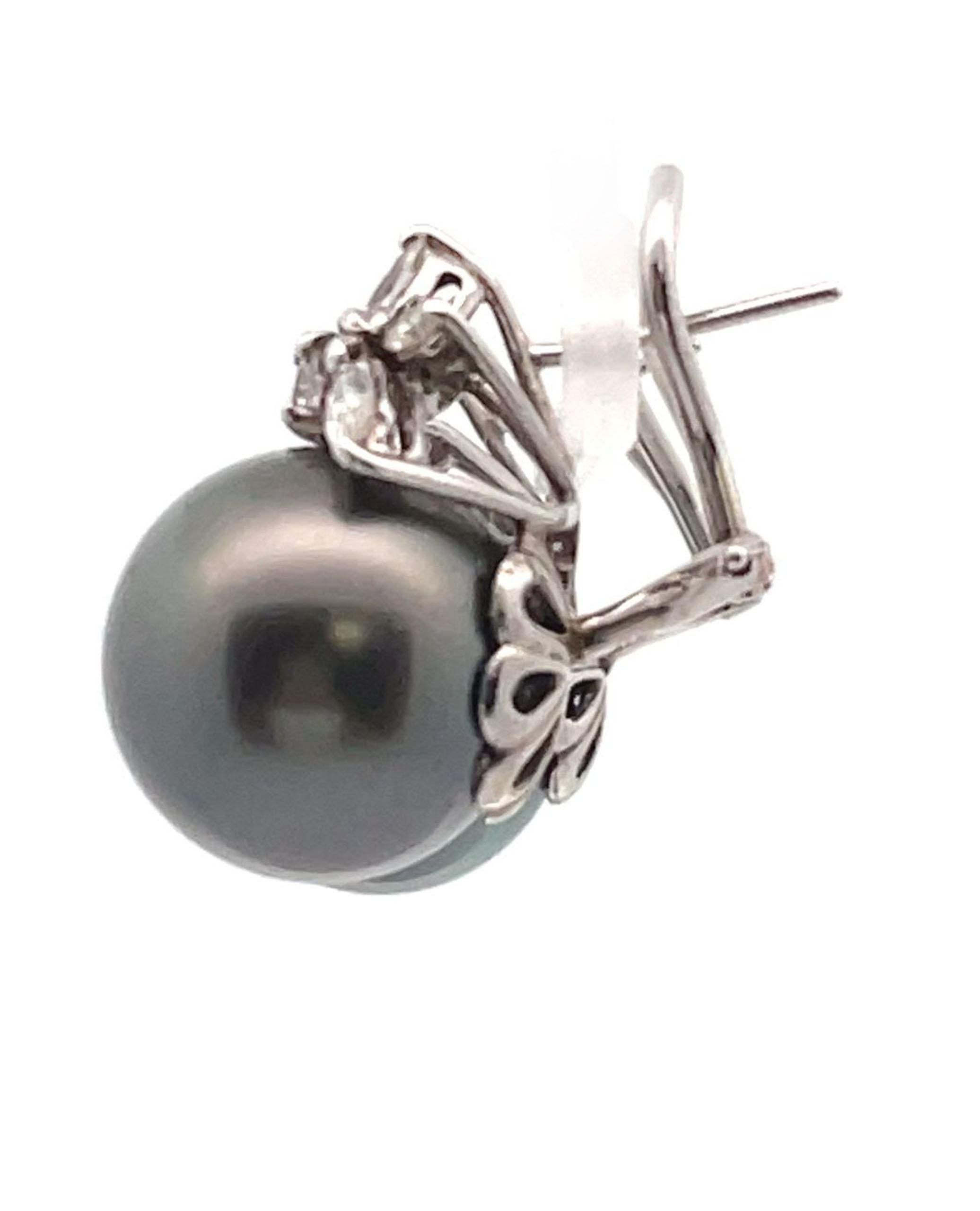 14K white gold earrings with marquis, round and pear shape diamonds weighing 1.60 carats total and two black Tahitian South Sea pearls measuring approximately 14.03mm each.

- Omega back closure
- Diamonds are H color, SI1 clarity
