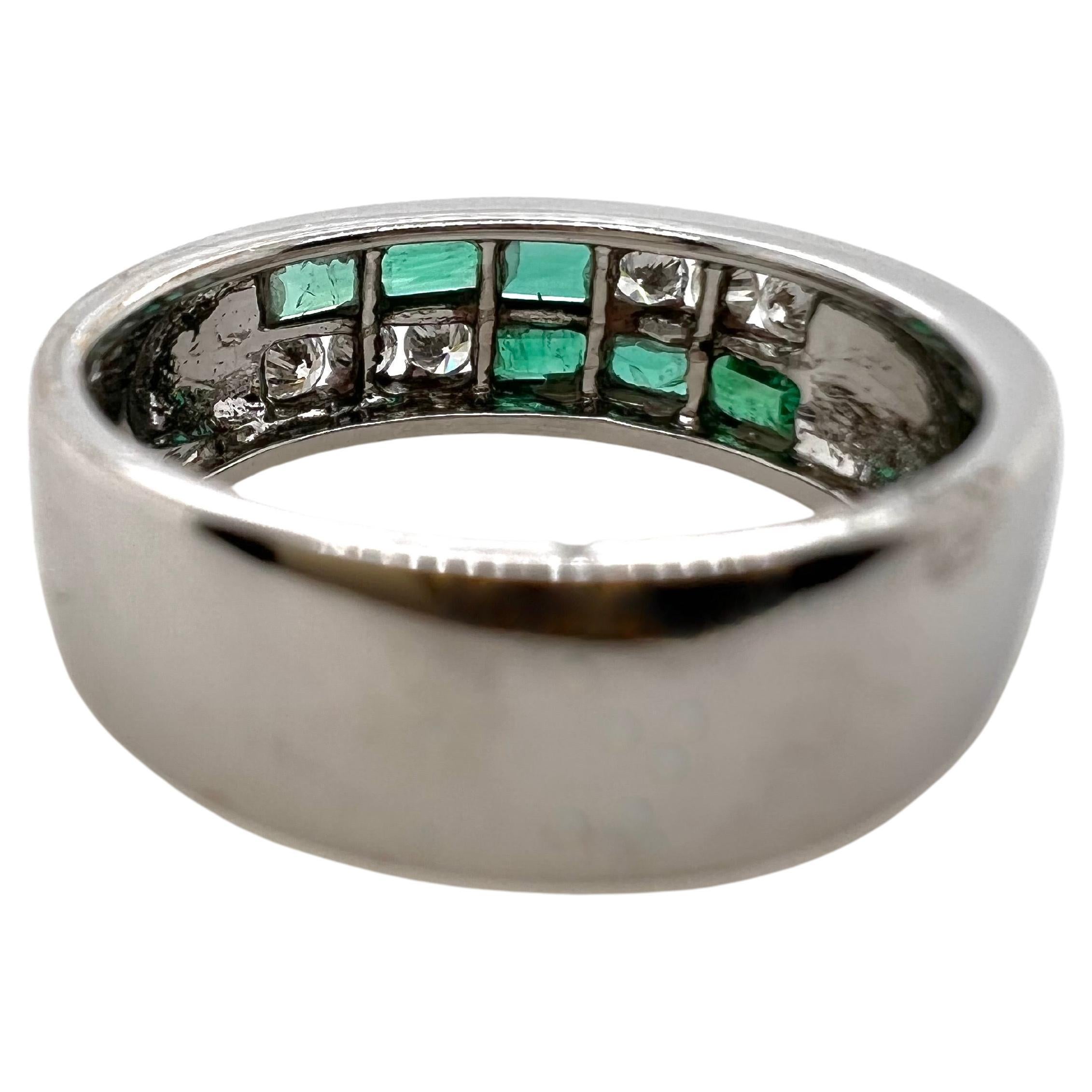 This contemporary emerald and diamond band will grasp everyone's attention for its sleek, modern lines.  The baguette emerald are channeled set with the brilliant round diamonds in this low profile band ring.


Size: 8.75 / can be sized
Stone: