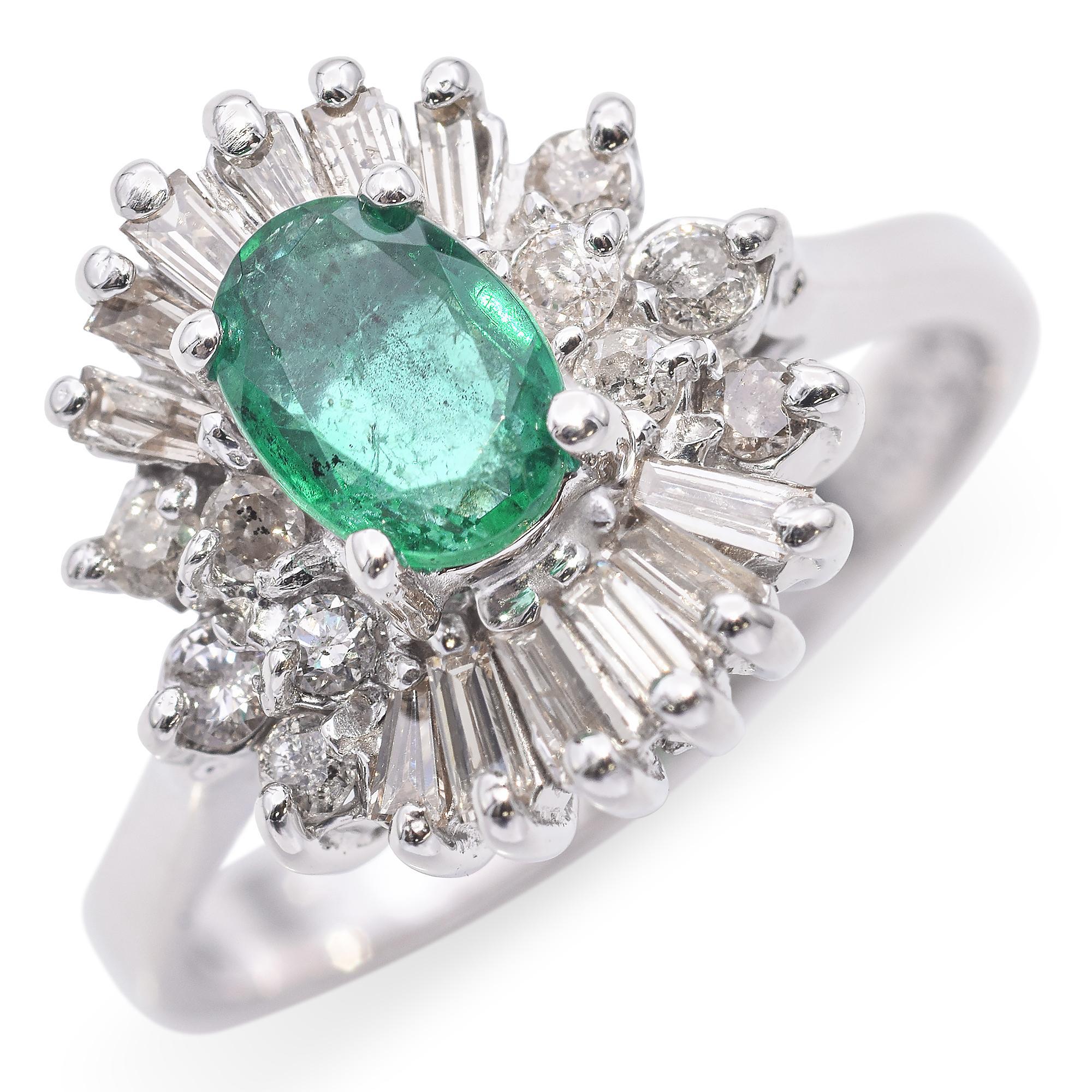 A striking and elegant ring featuring a captivating oval-shaped emerald.
The ring is adorned with baguette and round brilliant-cut diamonds, meticulously arranged around the emerald in a radiant style.

Weight: 4.2 grams 
Stone: Emerald and Diamond