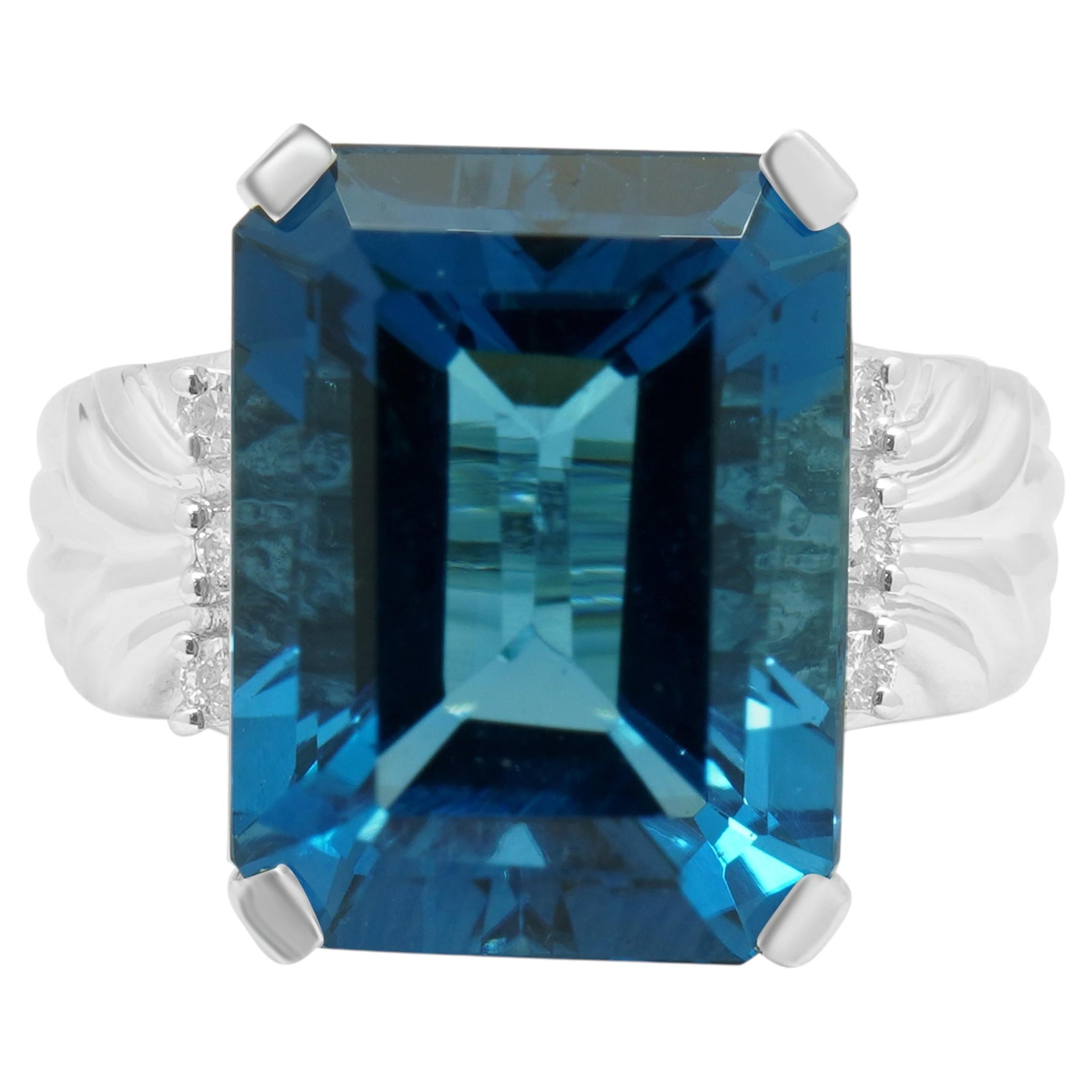 14K White Gold Emerald Cut Blue Topaz and Round Diamond Accent Ring