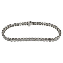 Bracciale tennis con diamanti taglio smeraldo in oro bianco 14K 6,10ct FG VS