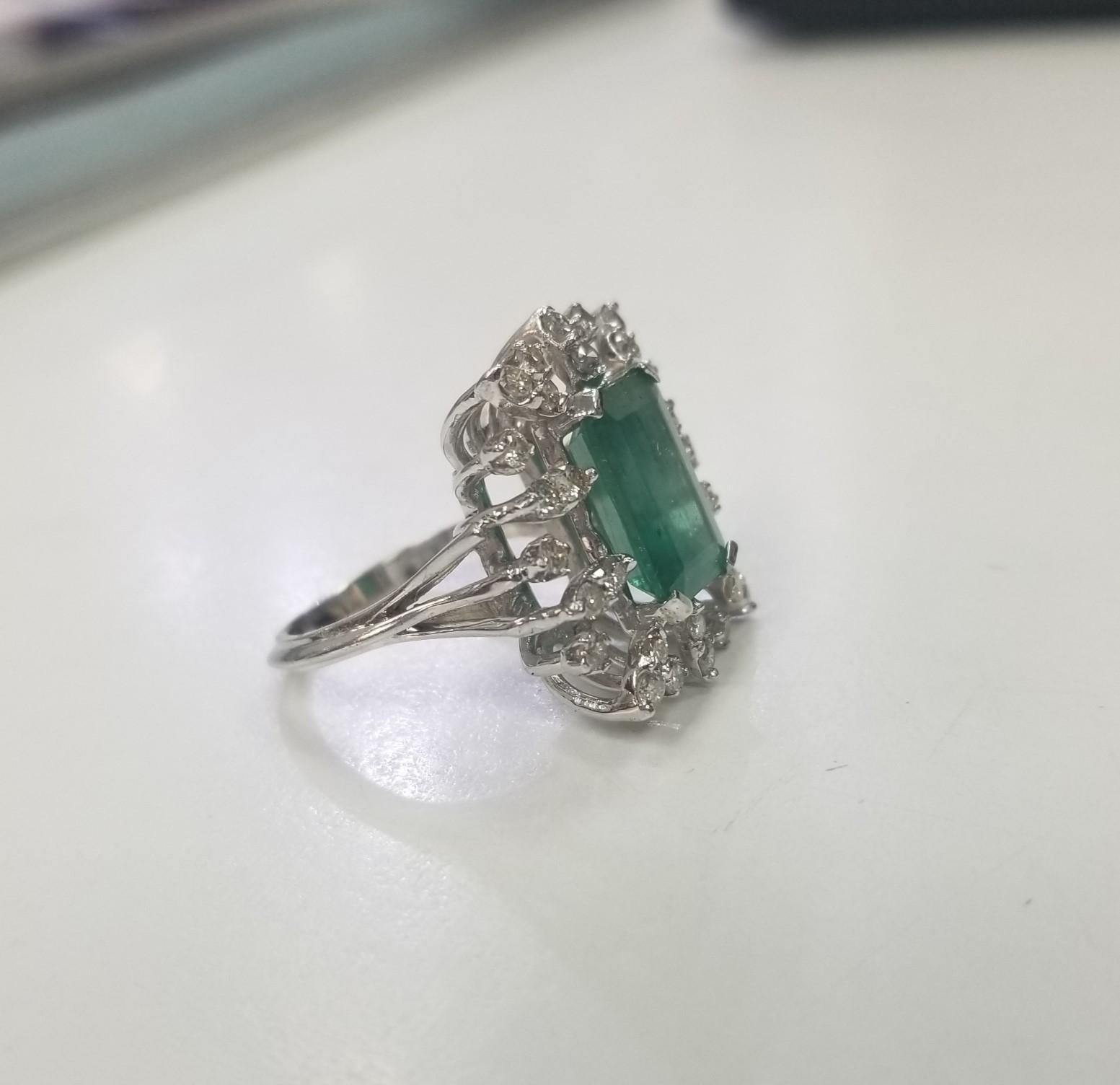 Specifications: 
    Metal: 14k white gold
    Weight: 8.6 Gr
    Main Stone: Emerald Cut Emerald 5.20cts.
    Side Stones: 30 Diamonds    
    Weight: .60cts.
    Color: G
    Clarity: SI
    Size: 6.5 US






