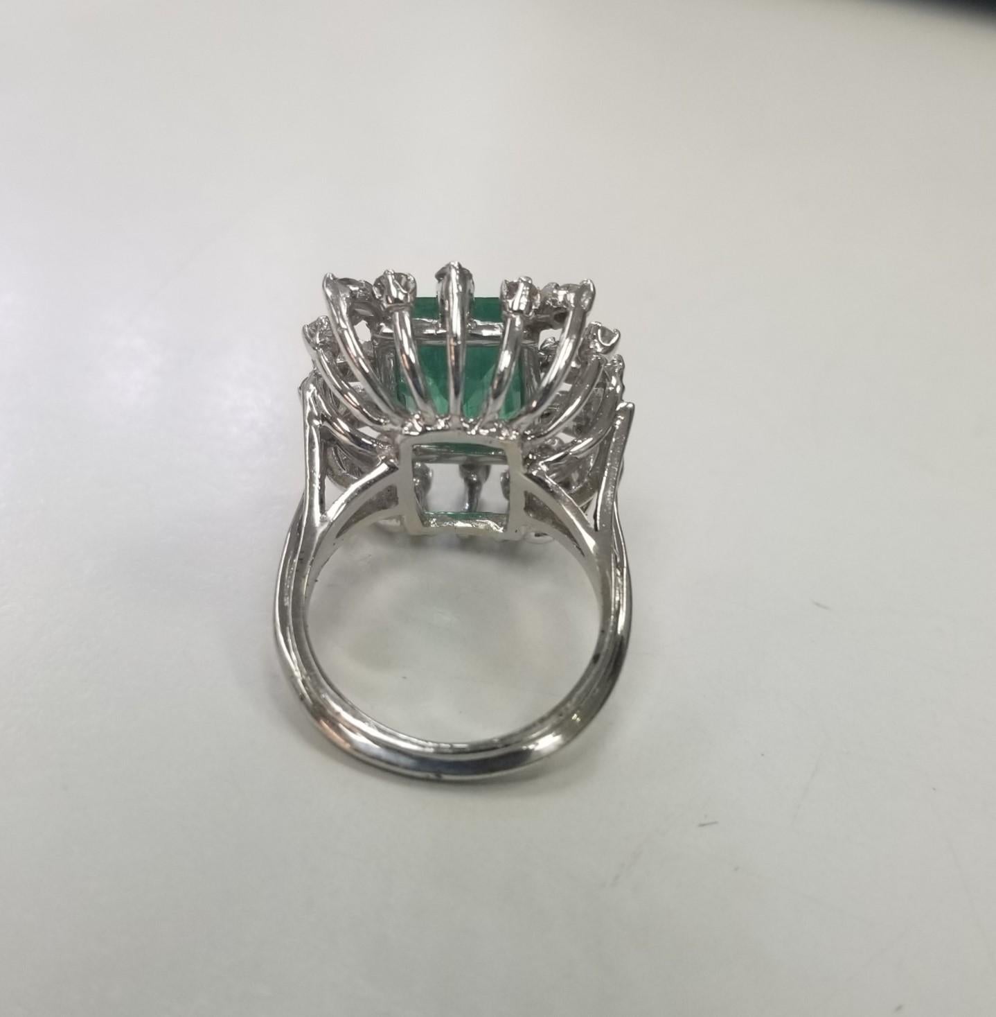 Contemporary 14k White Gold Emerald Cut Emerald and Diamond Cluster Ring