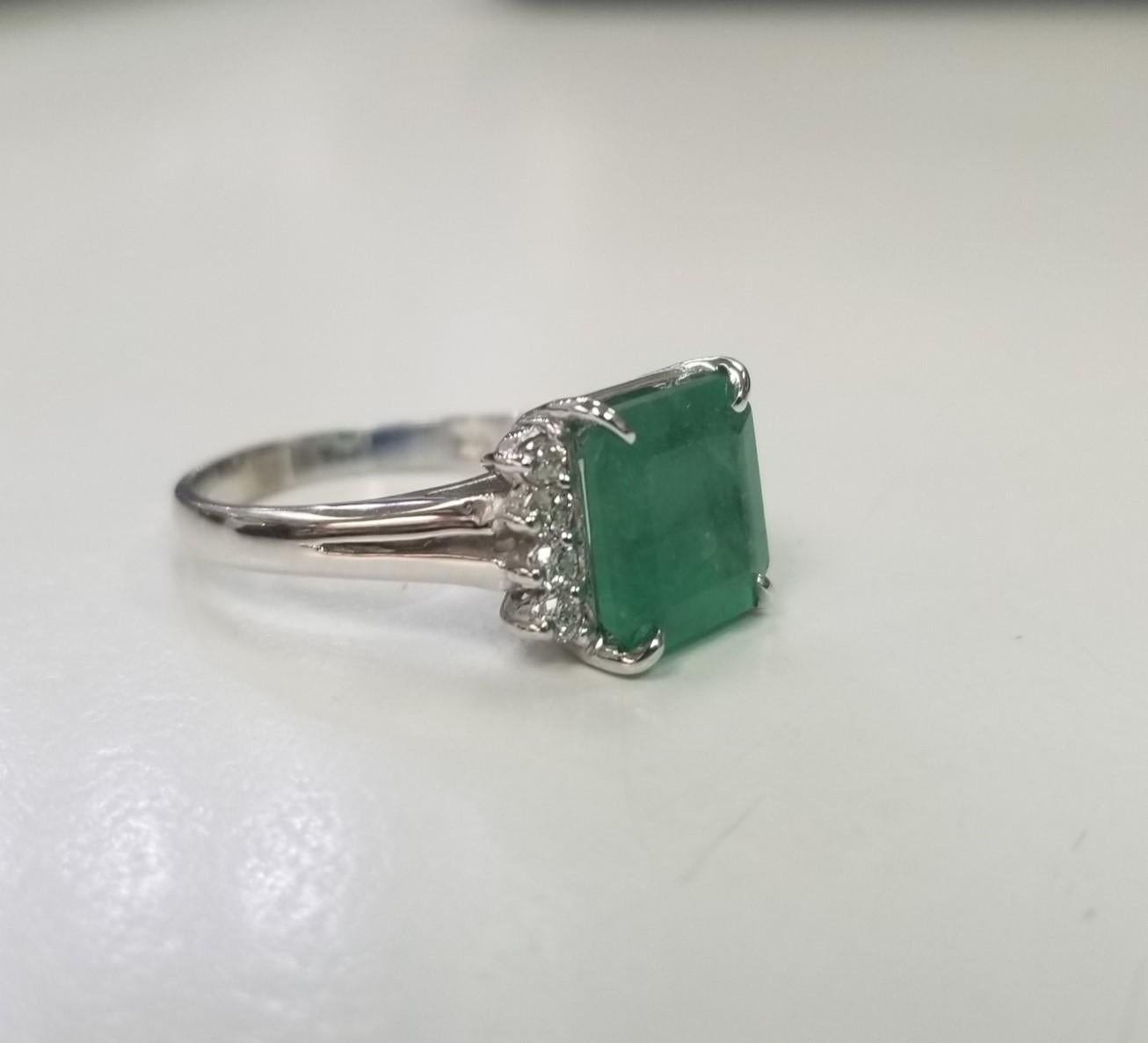 *Motivated to Sell – Please make a Fair Offer*
Specifications: 
    Metal: 14k white gold
    Weight: 4.3 Gr
    Main Stone: Emerald Cut Emerald 3.01cts.
    Side Stones: 8 Diamonds    
    Weight: .21cts.
    Color: G
    Clarity: VS2
    Size: 6.5