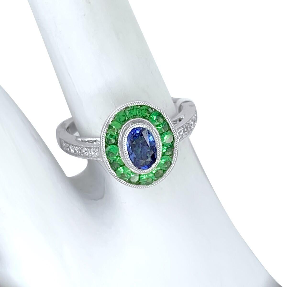Art Deco at its best, using French calibre cut Precious Gemstones.

New World Technology meets Old World Styles!

Material: 14k White Gold
Hallmark: 14K JH
Ring Size: 6.5 
Gemstone: Sapphire/ Tsavorite and Diamond
Sapphire Weight: 1.07