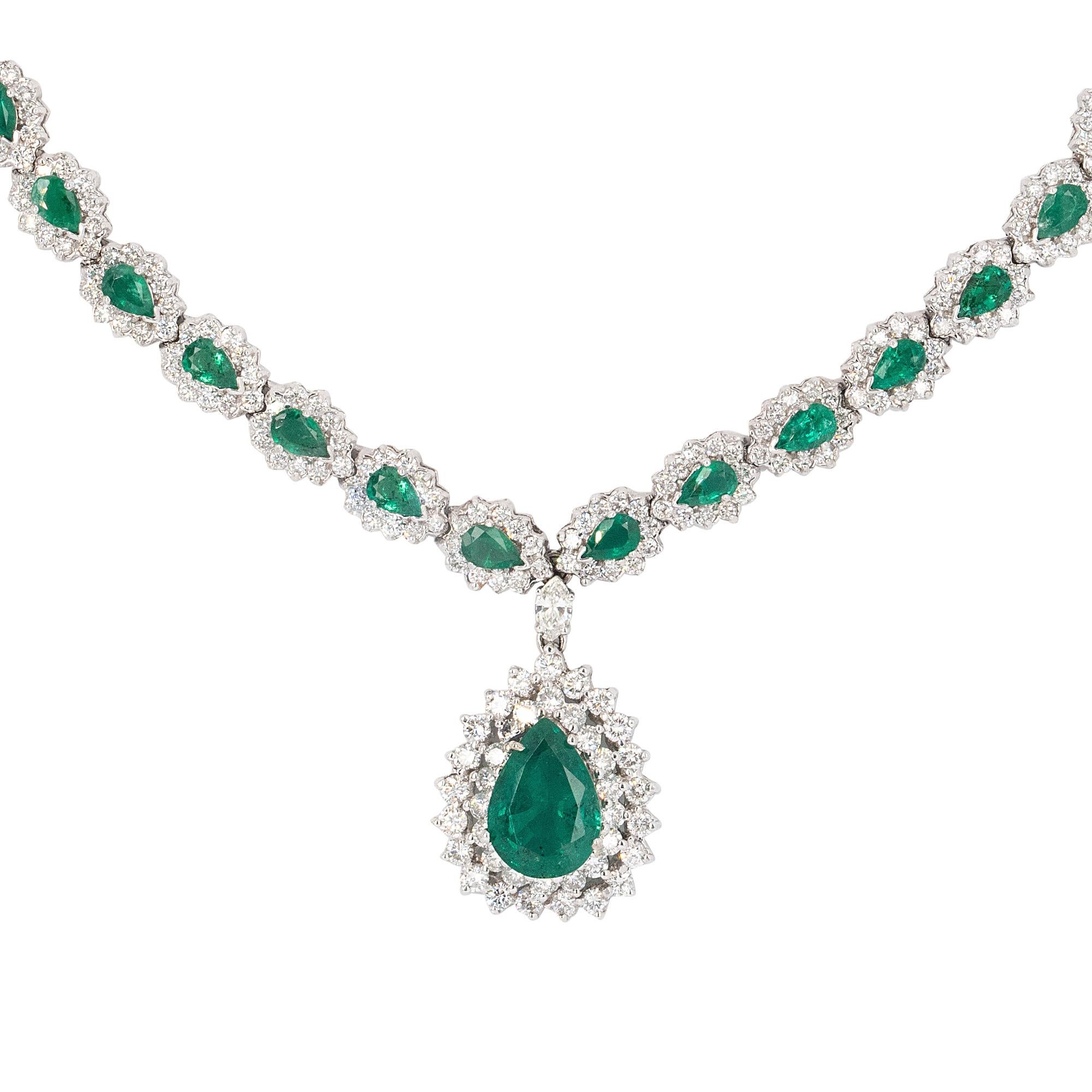 Material: 14k White Gold
Emerald Details: Approx 6ct total Emerald Weight, Approx 10.5ctw
Diamond Details: Natural Diamonds Approx 5ctw
Total Weight: 47.1g (30.3dwt)
Center Measurements: 25.9mm x 21.2mm x 10.9mm
Chain Measurements: 17