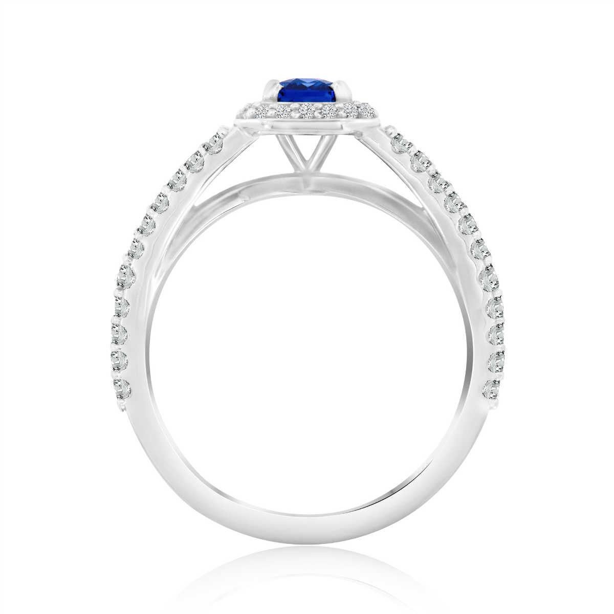 This elegant ring features a 0.82 carat Emerald shape, Sri Lankan Blue Sapphire encircled by a halo of round melee diamonds. A scalloped micro-prong split-shank band adds a dazzling effect. Experience the difference in person!

Product details: