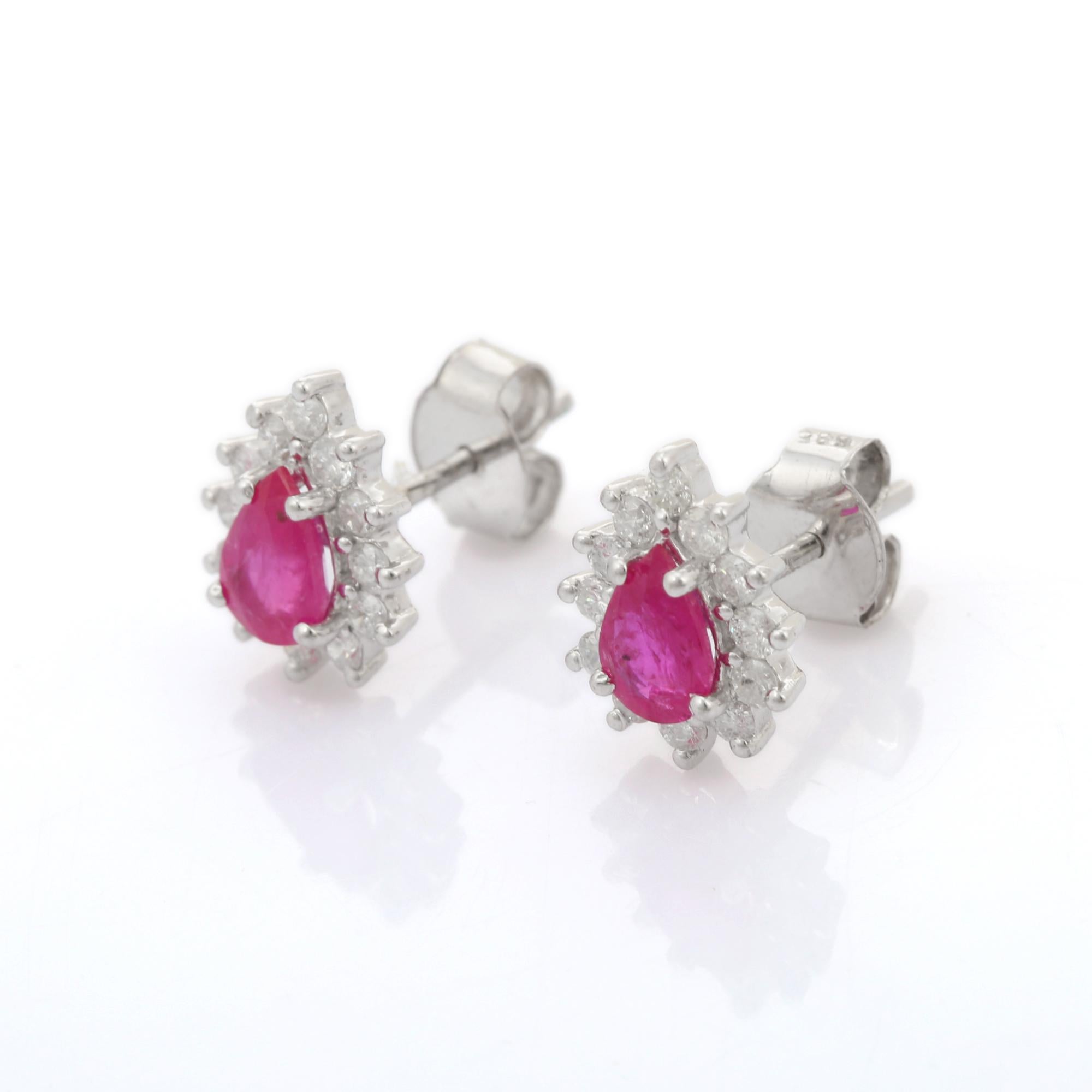 Studs create a subtle beauty while showcasing the colors of the natural precious gemstones and illuminating diamonds making a statement.
Fine Pear Cut 1.02 ct Ruby Stud Earrings with Diamonds in 14K gold. Embrace your look with these stunning pair