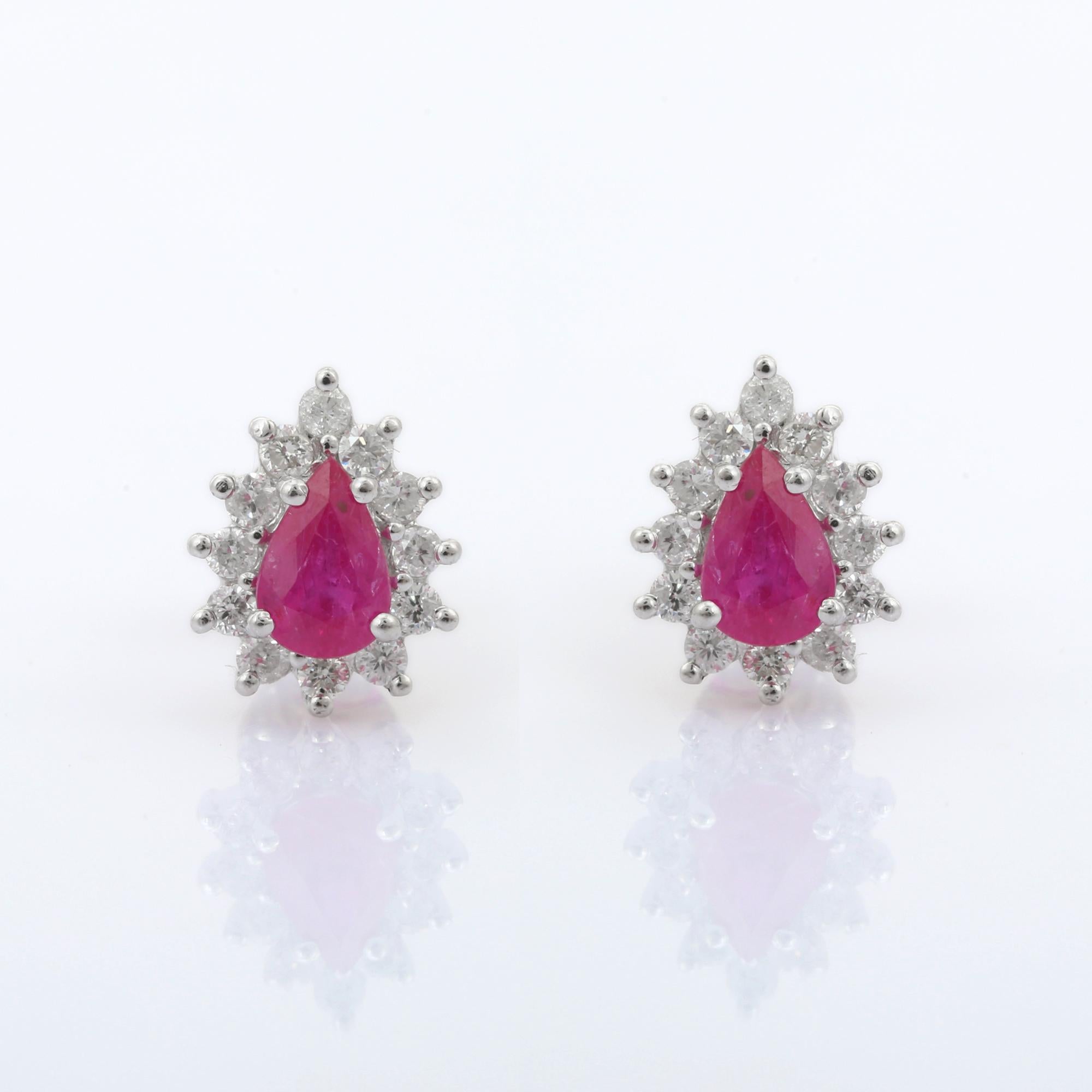 Women's 14K White Gold Fine Pear Cut 1.02 ct Ruby Stud Earrings with Halo of Diamonds For Sale
