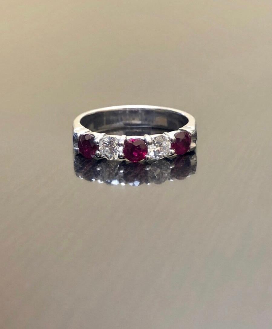 DeKara Designs Collection

Metal- 14K White Gold, .583.

Stones- 3 Natural Round Pigeon Blood Rubies 1.00-1.10 Carats, 2 Round Diamonds H Color SI1-SI2 Clarity 0.44 Carats.

Size- 7 Available Now

Size- 3-12

Band is 3.9-4.00 MM Wide.

Can be made