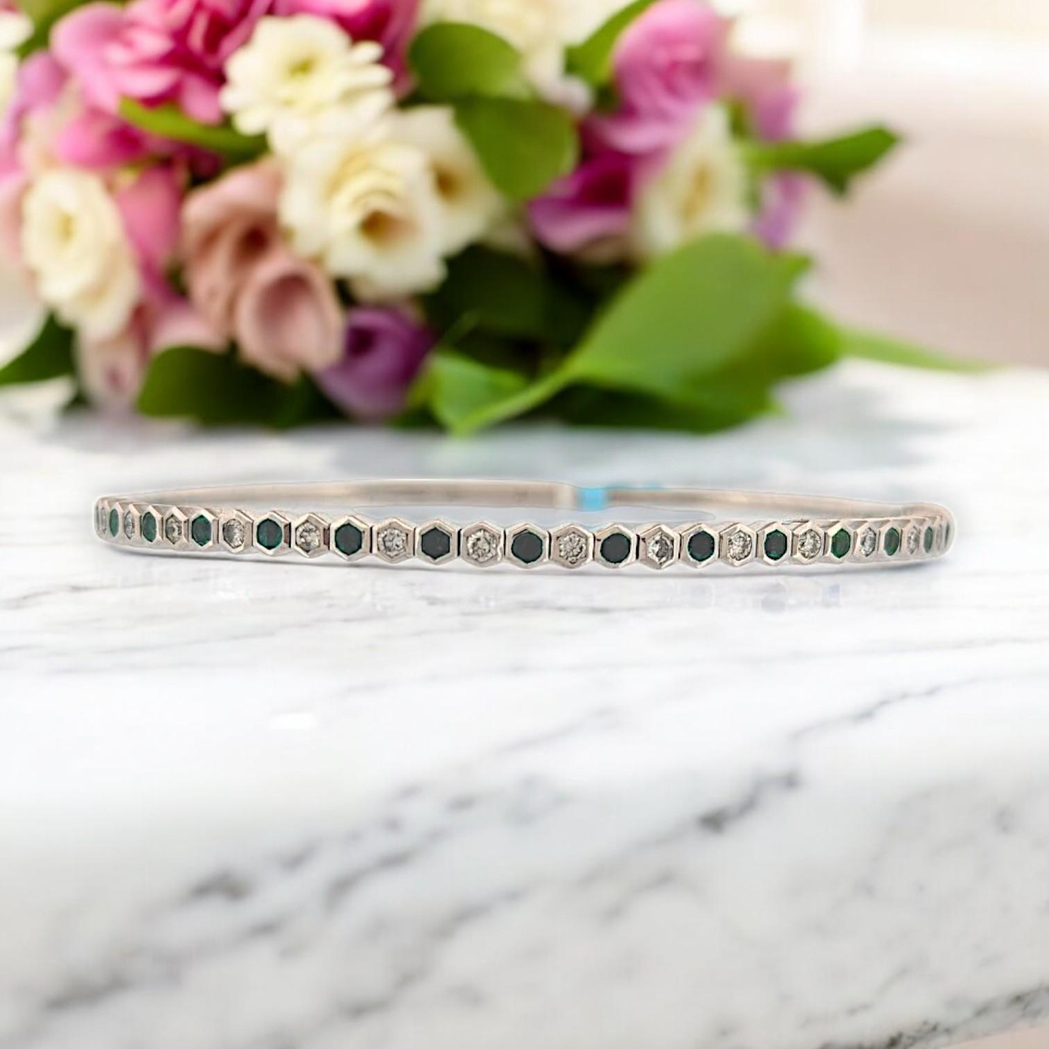 This stunning 14K white gold flex bracelet features .50 CT natural round Emeralds paired with .55 CTW natural Diamonds, offering vibrant color and dazzling brilliance in every curve. At 6.5