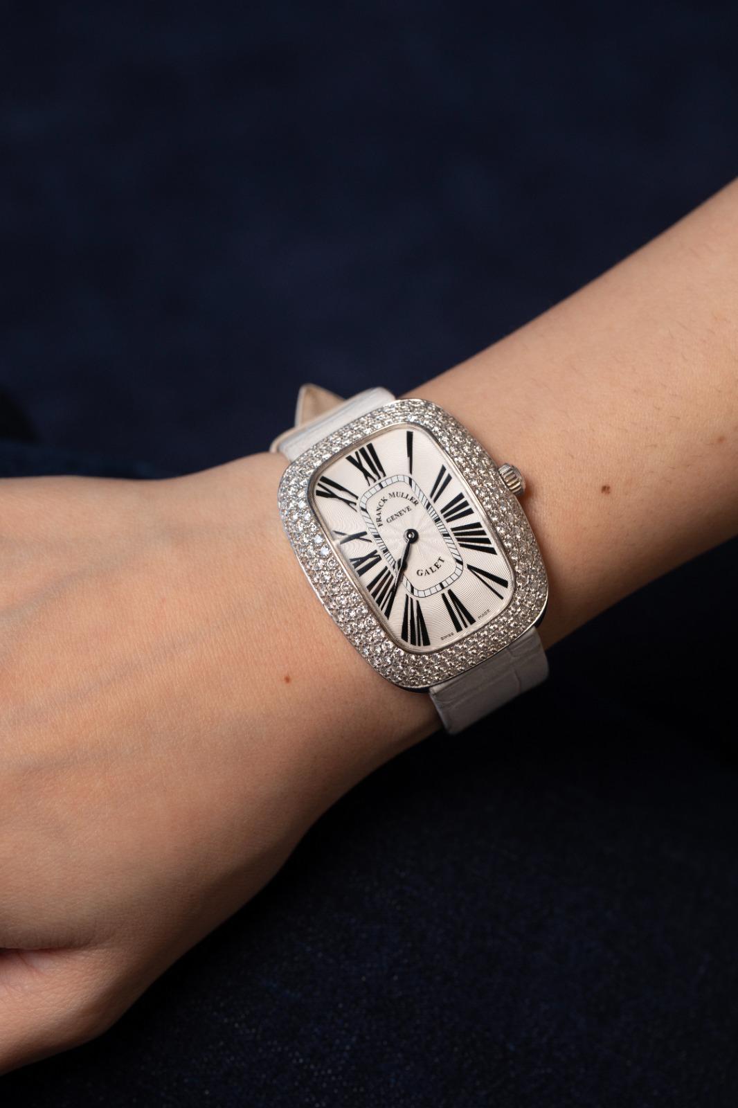 Brand: Franck Muller
Model: Galet
Material: 14K White Gold
Bezel: Diamond-set bezel with brilliant-cut diamonds
Dial: White dial with bold black Roman numerals and blued steel hands
Movement: Swiss-made high-precision mechanical movement
Strap: