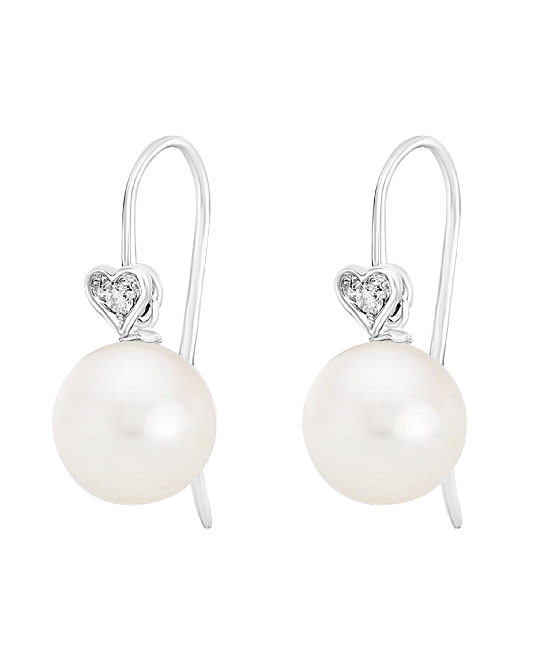 These elegant Diamond and Pearl earrings contain Chinese Freshwater round cultured pearls set on 14K white gold french wire and diamond hearts with 0.06 carats of diamonds. Simple, yet elegant, these earrings are a great addition to any