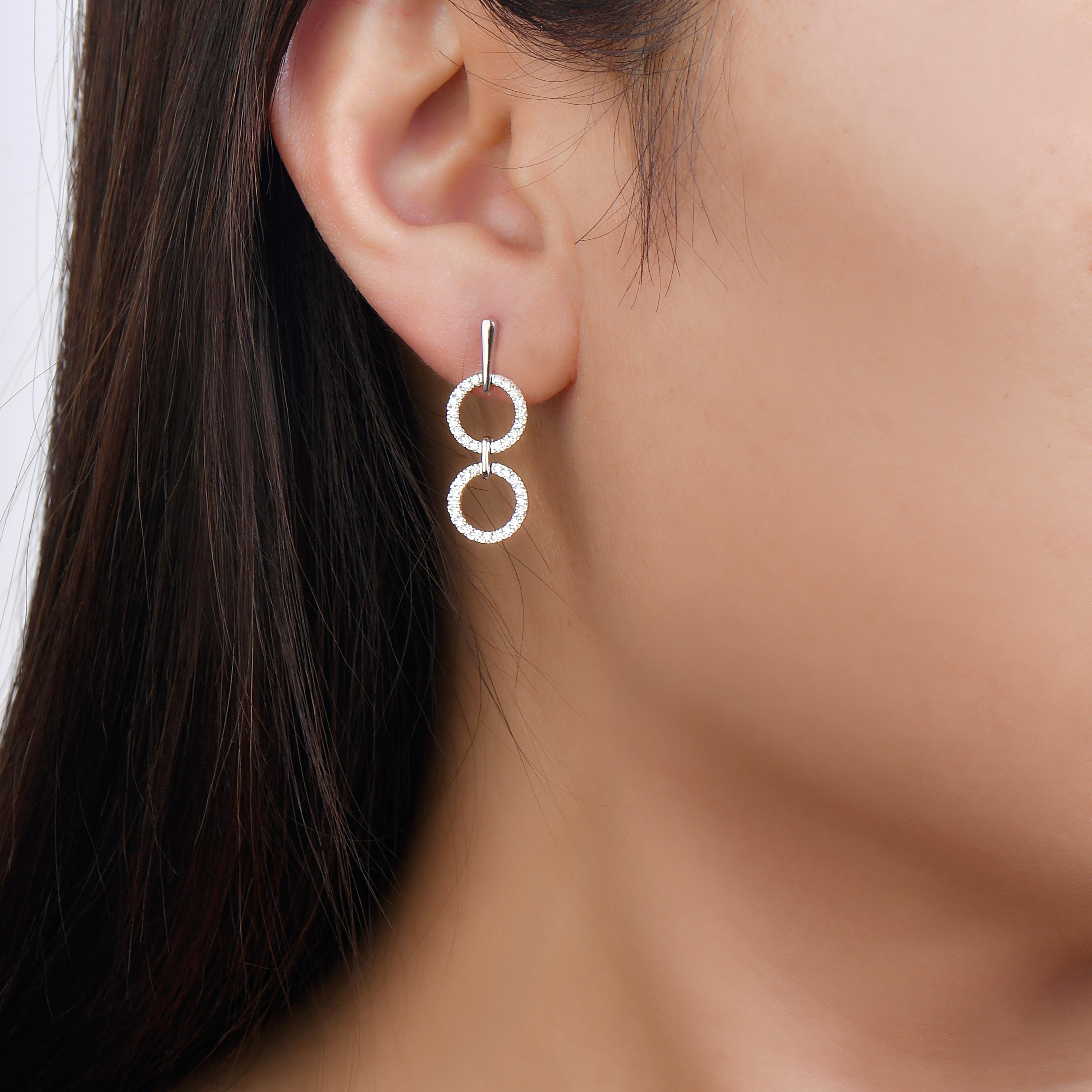 A different take on dangling earrings, these geo art earrings have more of a hang than a dangle. However, that does not make them any less stunning. The diamond dangling earrings in 14K white gold are perfect to gift someone you share a special