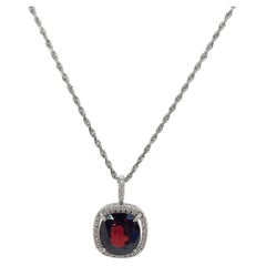 14K White Gold Garnet and .33 CTW Diamond Halo Pendant Necklace