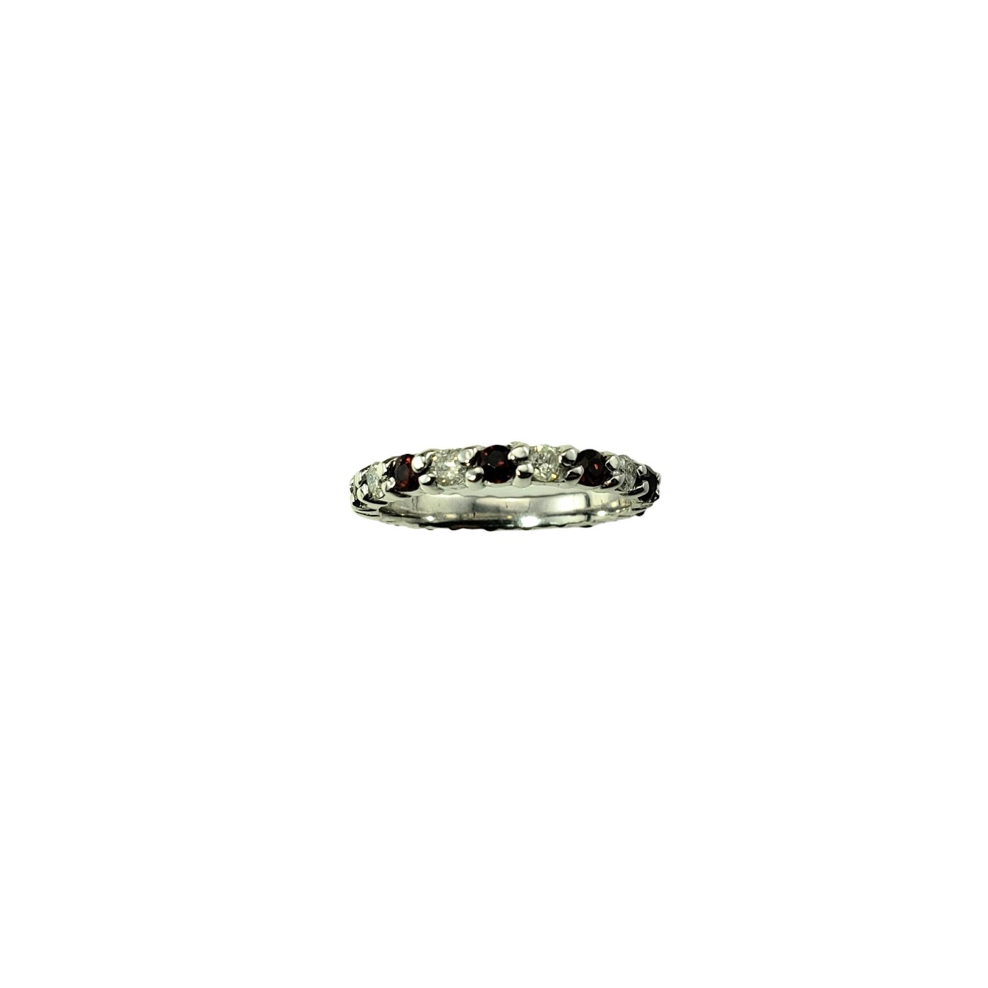 Vintage 14 Karat White Gold Garnet and Diamond Eternity Band Ring Size 6.25 JAGi Certified-

This lovely eternity band features ten round garnets and ten round brilliant cut diamonds set in classic 14K white gold.  Width: 3 mm.

Total garnet weight: