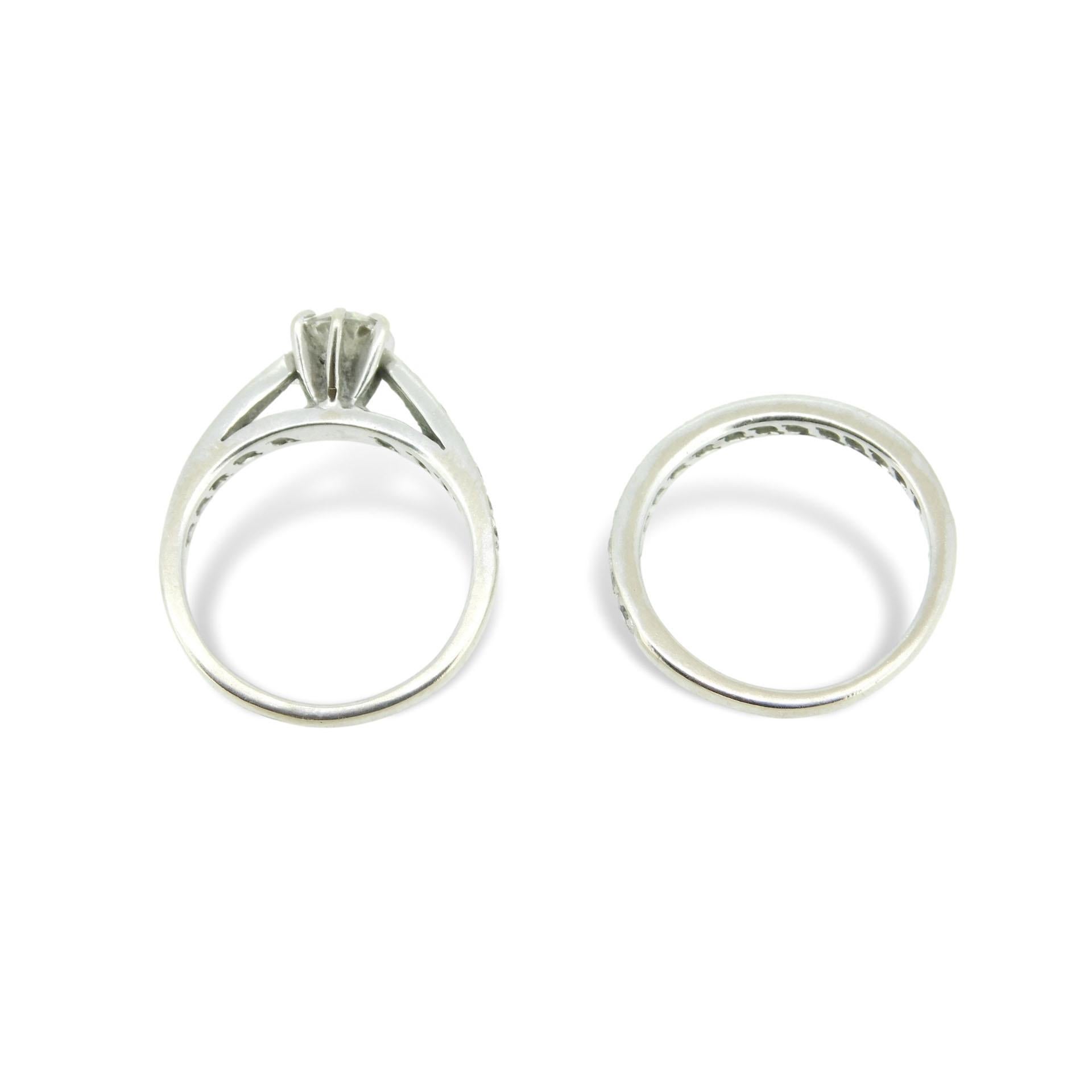 

14k white gold diamond engagement ring and wedding band set. The solitaire features a European cut diamond that measures 5.1mm and weighs approximately 1/2 carat. The diamond has SI clarity and I-J color. 

The solitaire has six round brilliant