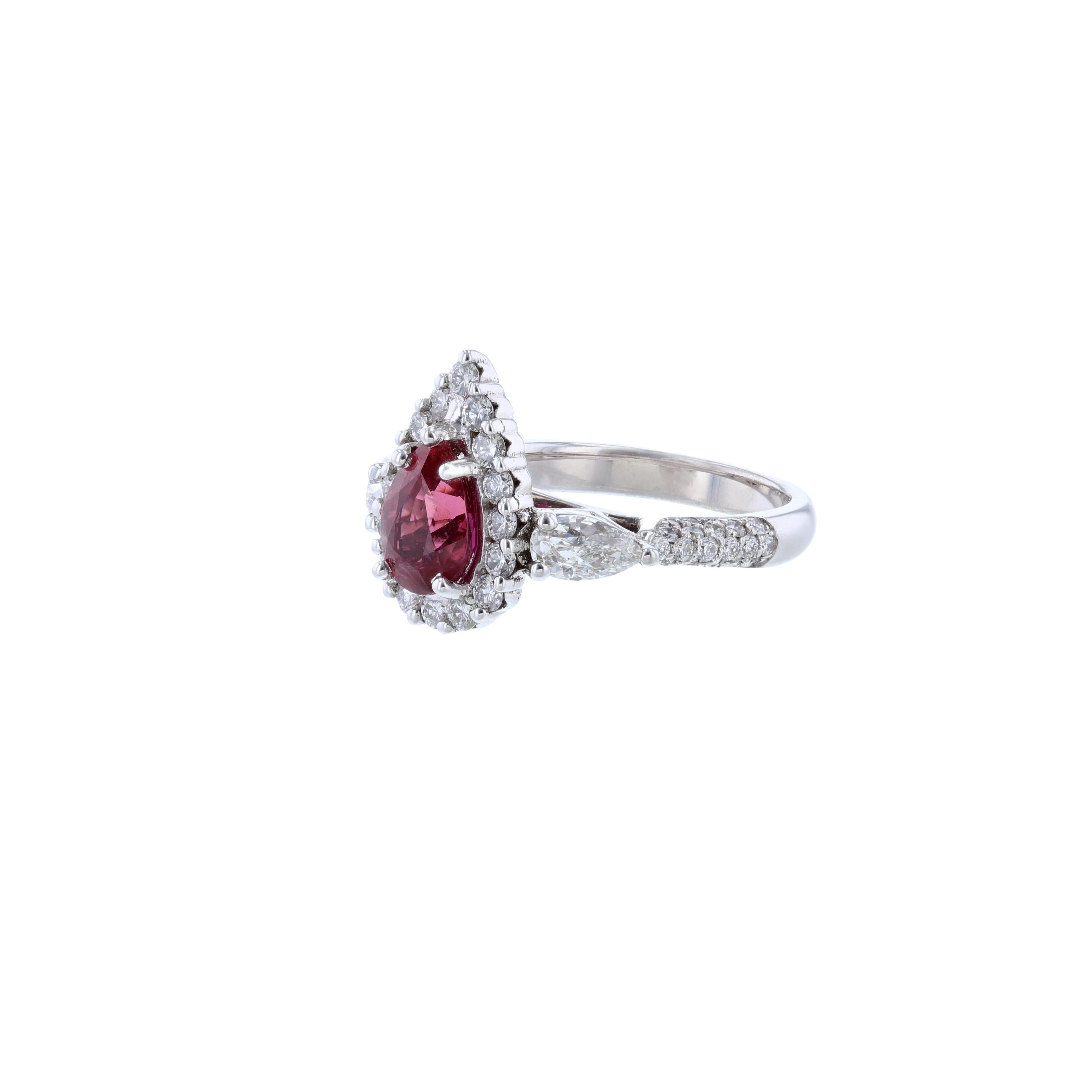 This ring is made in 14K white gold and features 1 pear shape natural corundum (no heat) ruby weighing 1.82 carats with a color grade (Red). WIth a GIA Report Number 5131284597. Includes 2 pear shape diamond accents weighing 0.77 carat. Surrounded