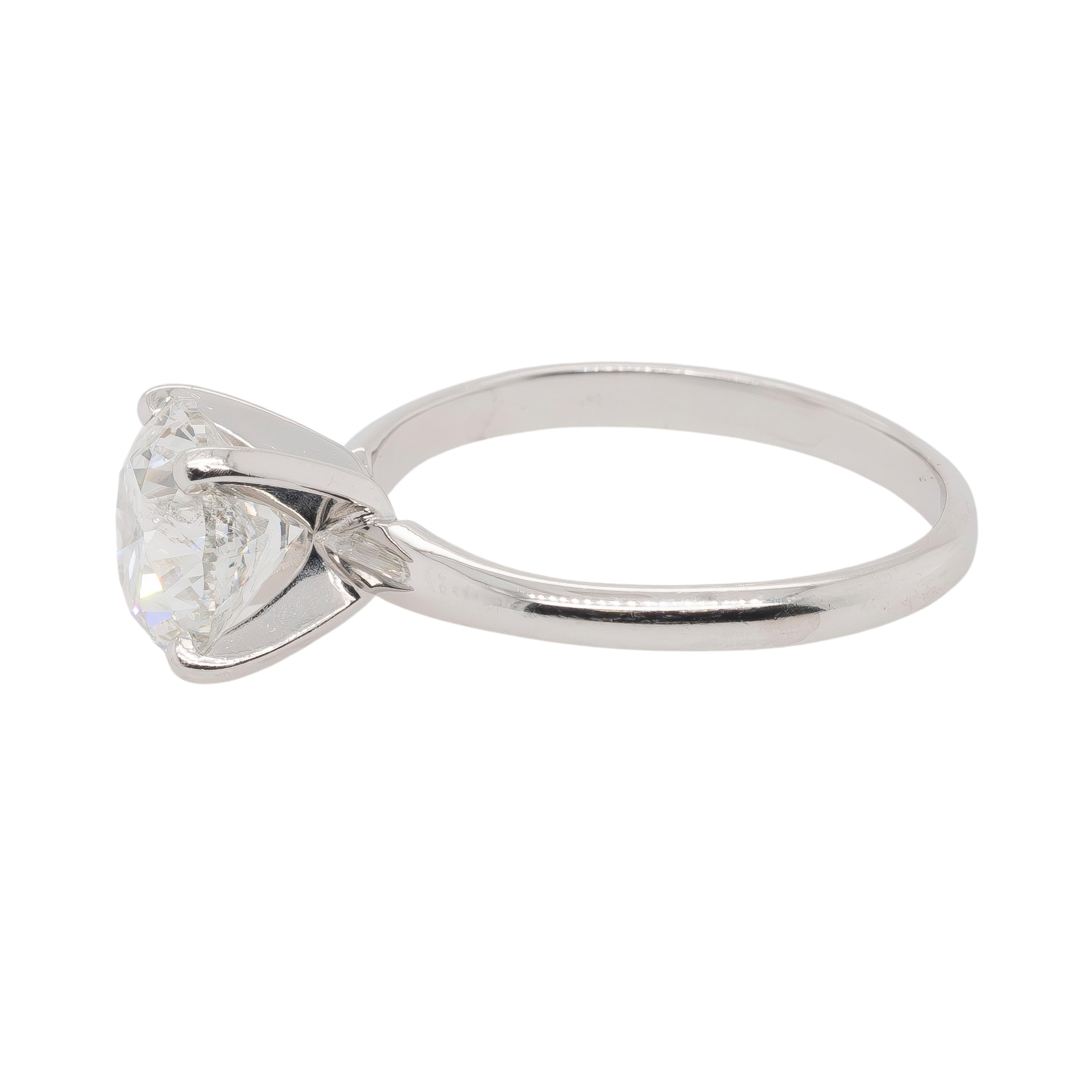 This exquisite 14K White Gold Engagement Ring showcases a breathtaking 2-carat Natural Round Brilliant Diamond certified by GIA (#6425856425). With an SI2 clarity and F color grade, this diamond boasts exceptional brilliance and a dazzling,