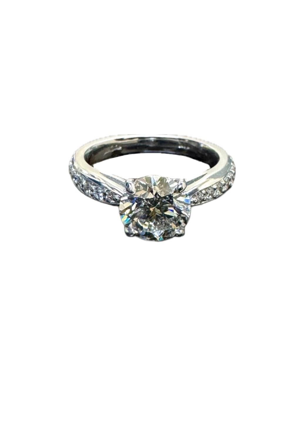 DeKara Design Collection

Modern 14K White Gold Diamond Engagement Ring.

Metal- 14K White Gold, .583.

Stones- GIA Certified I Color I1 Clarity 1.70 Carat Diamond, 16 Round Diamonds G-H Color VS2 Clarity 0.40 Carats.

Ring Comes With GIA