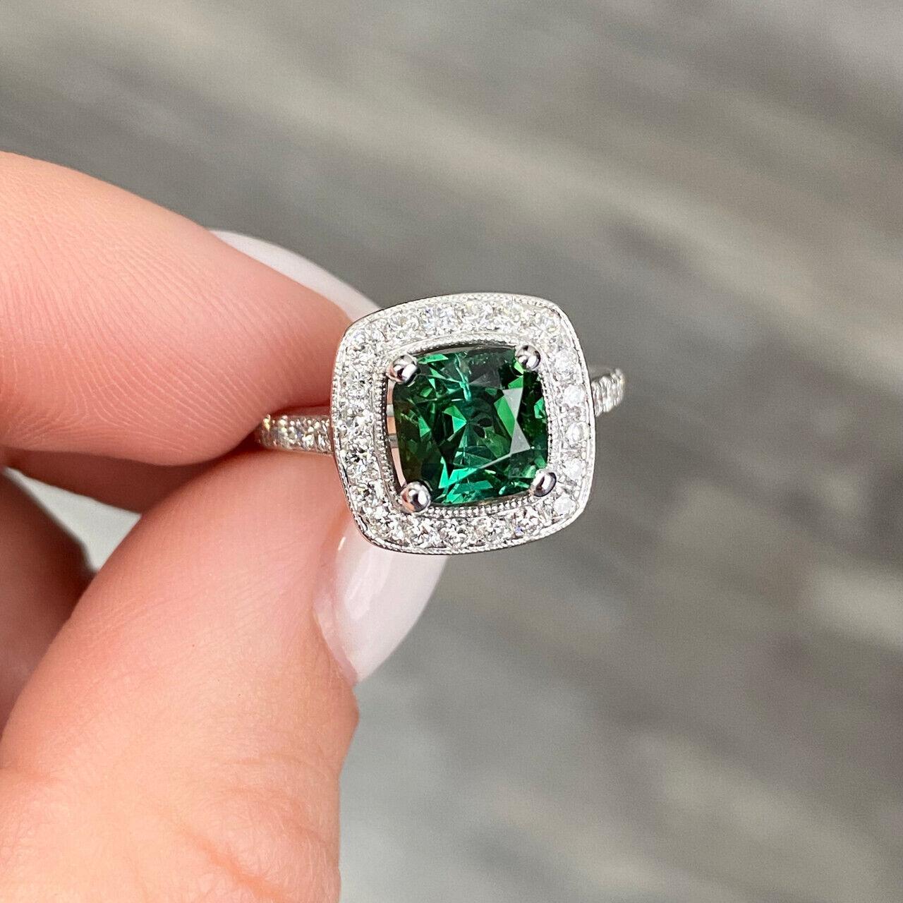 Specifications:
Pre-Owned (Great condition)
Metal: 14K White Gold
Weight: 4.1 Gr
Main Stone: 1.91 ct Green Tourmaline
Side Stones: Diamonds
Carat Total Weight: 0.40 ctw
Color: G
Clarity: VS-SI1
Size: 4.5 US
inside balls can be removed and sized to