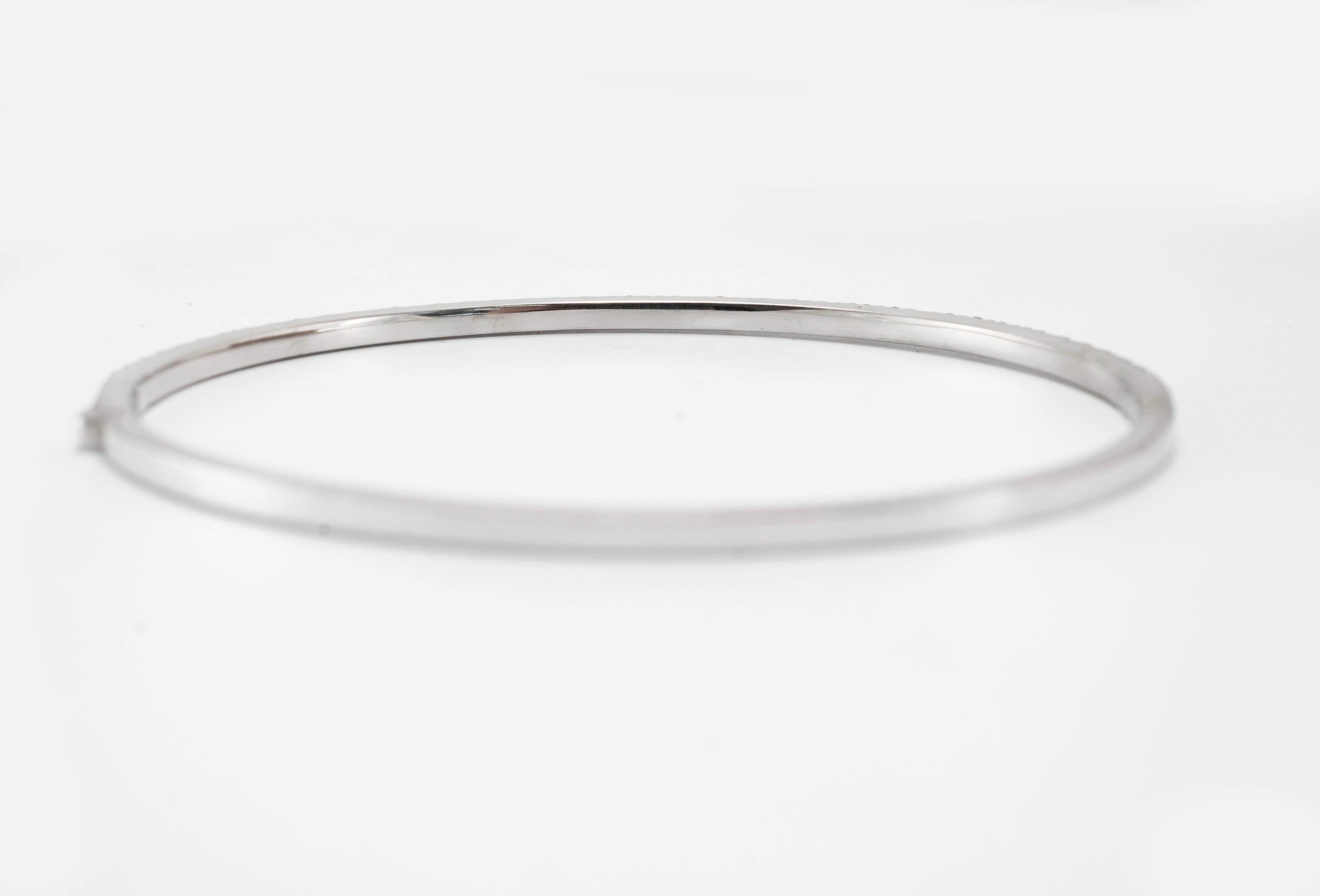 Gender: Women's

Metal Type: 14K White Gold

Length: 6.75 inches

Width: 2.45 mm

Weight: 9.72 grams

Ladies rhodium plated 14K white gold, diamond bangle, tennis, line bracelet. Engraved with 