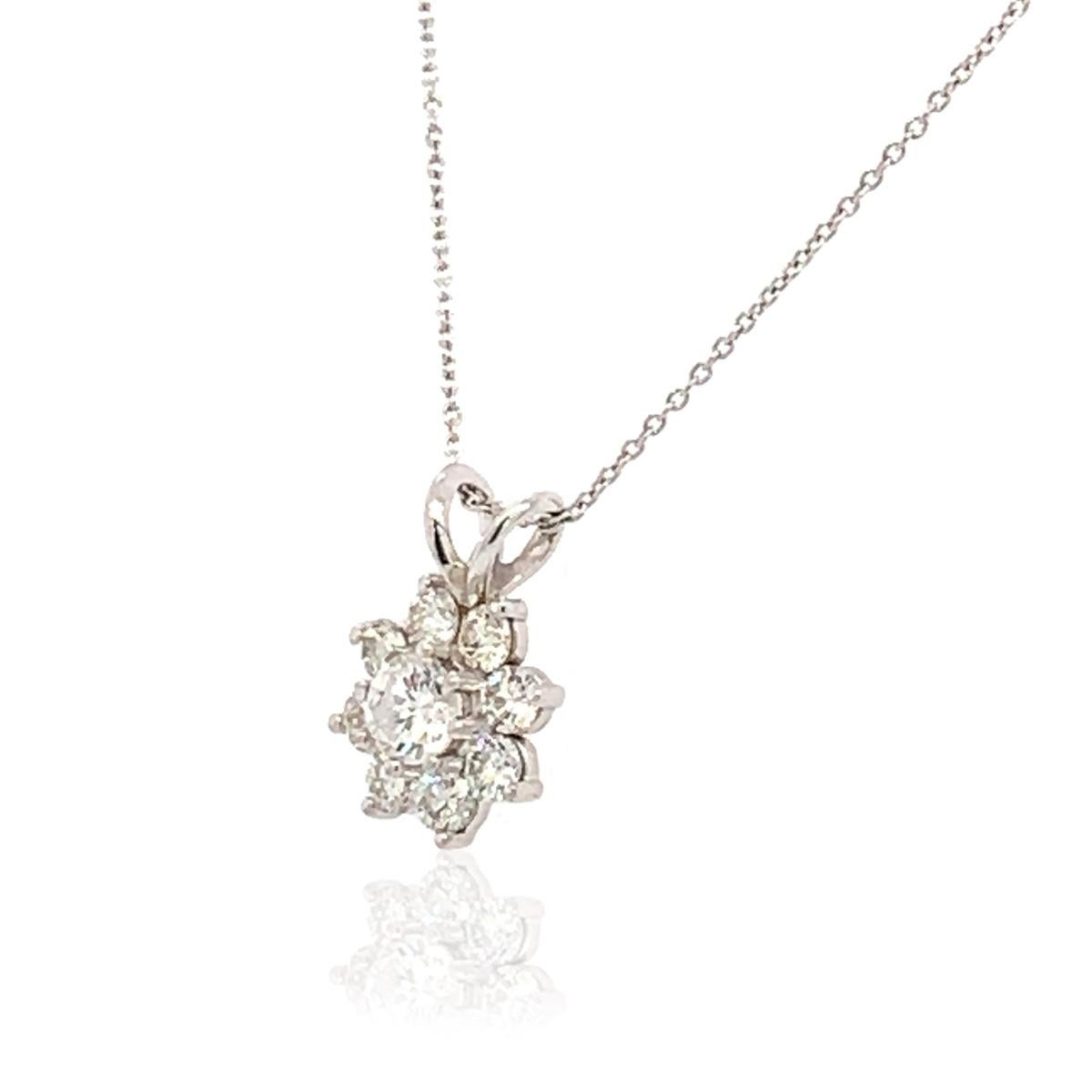 This halo diamond pendant features eight brilliant diamonds surrounding a round brilliant-cut center diamond. Set in 14k white gold, this 0.73 carat total weight pendant is all glitz! Experience the Difference!

Product details: 

Center Gemstone