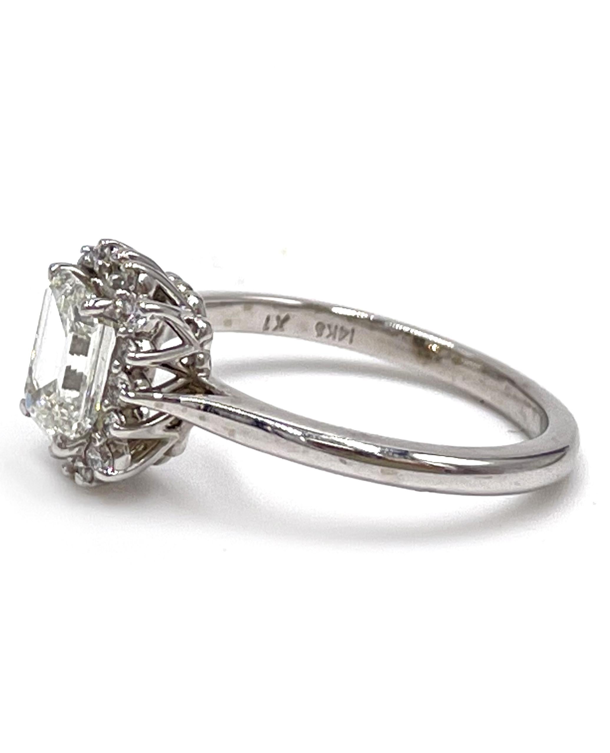 14K white gold halo engagement ring furnished with 16 round faceted diamonds 0.18 carats total weight. In the center there is one emerald cut diamond weighing 1.13 carats (H color, VVS2 clarity).

* Center emerald cut diamond is GIA certified
*