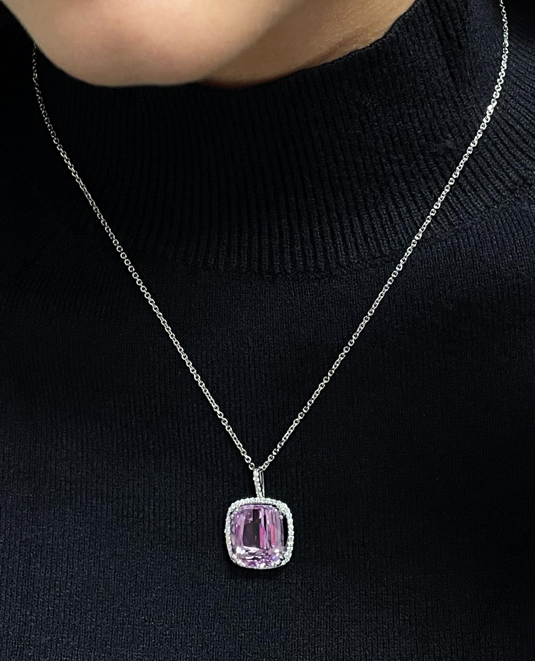 14K white gold cushion shape pendant necklace with 41 round diamonds 0.35 carats total and one center cushion shape kunzite 17.40 carats. The pendant slides on a 18 inch diamond cut cable chain.

- Diamonds are G/H color, SI clarity
- Kunzite