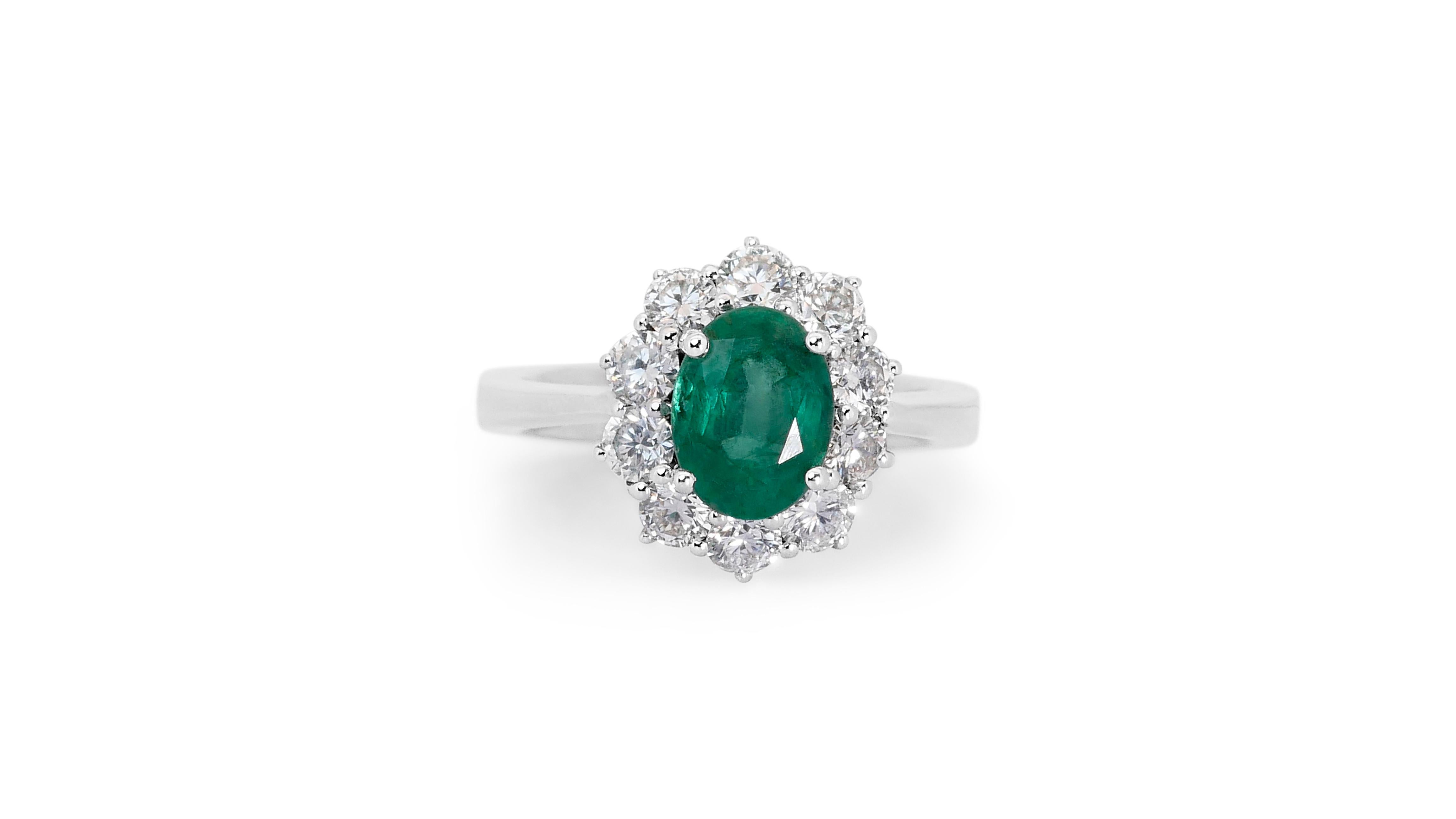 A glamorous flower-style ring with a stunning 1.5-carat oval mixed-cut natural emerald. It has 1 carat of side diamonds which add more to its elegance. The jewelry is made of 14K White Gold with a high-quality polish. It comes with an IGI