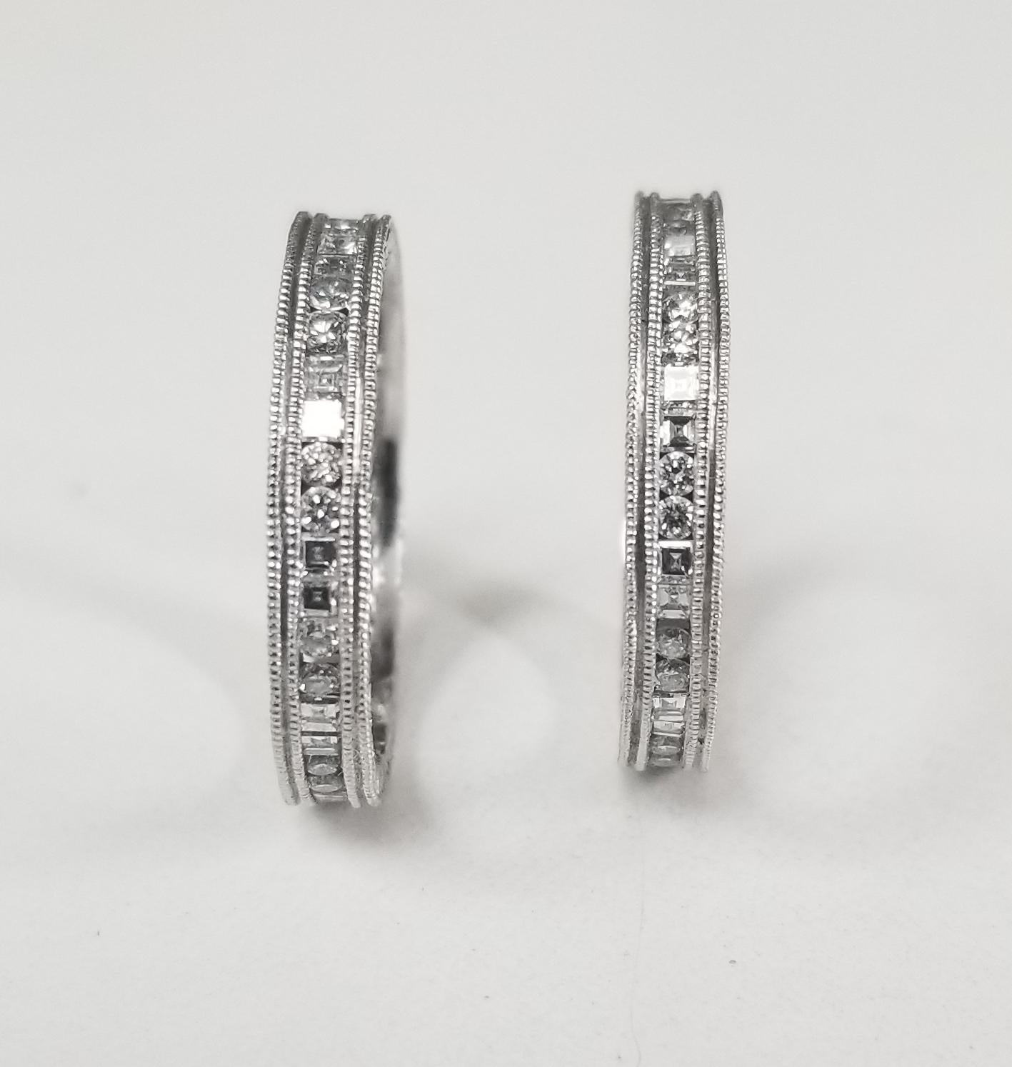 2-14k white gold hand engraved diamond square and round eternity ring, containing 22 square cut diamonds; color 
