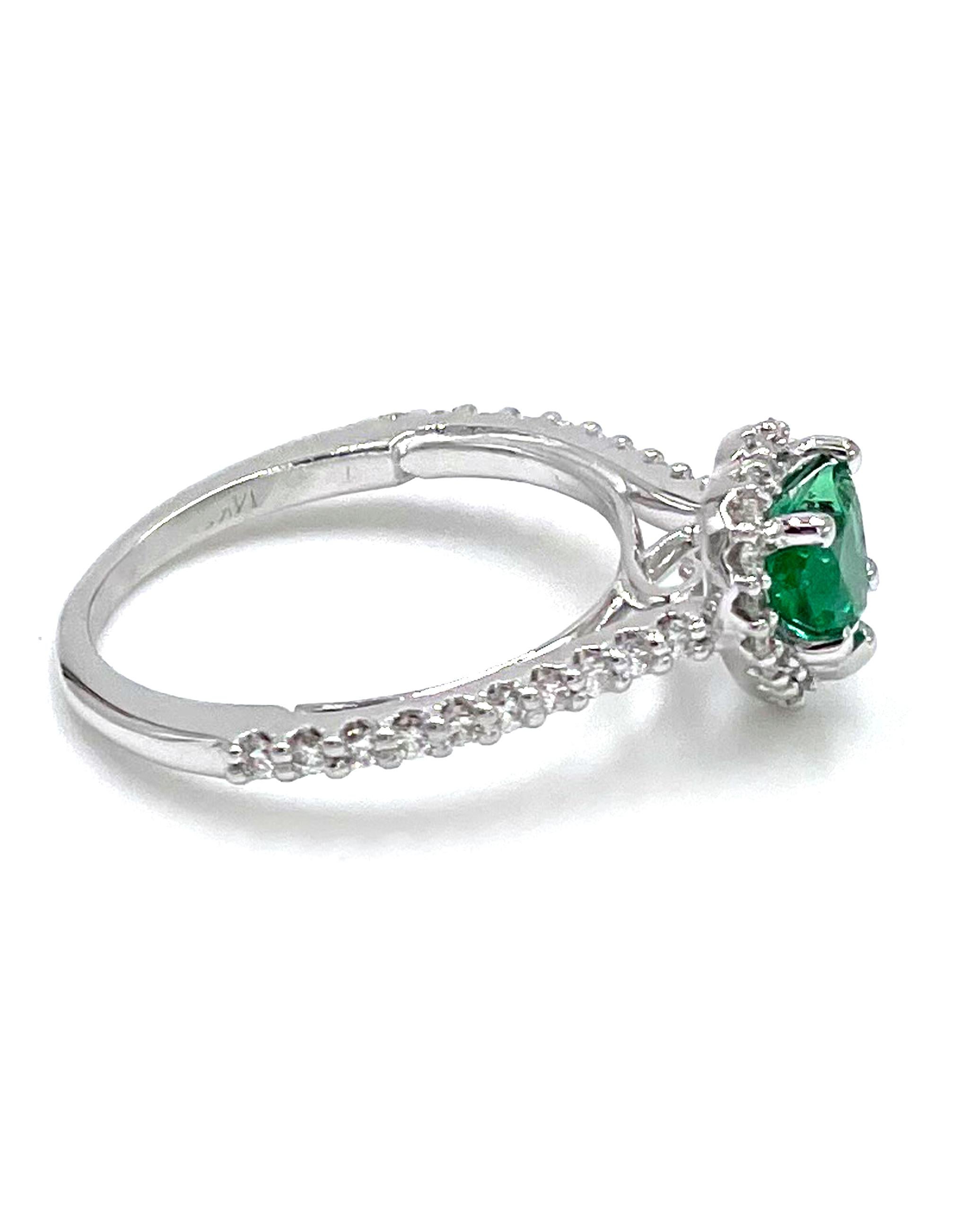 14K white gold heart shaped halo ring with 38 round, brilliant-cut diamonds 0.28 carat.  The center features one heart shape emerald weighing 0.52 carats.

* Diamonds are G/H color, SI1 clarity
* Finger size 5
* Top dimension: 8.40mm
* Band width: