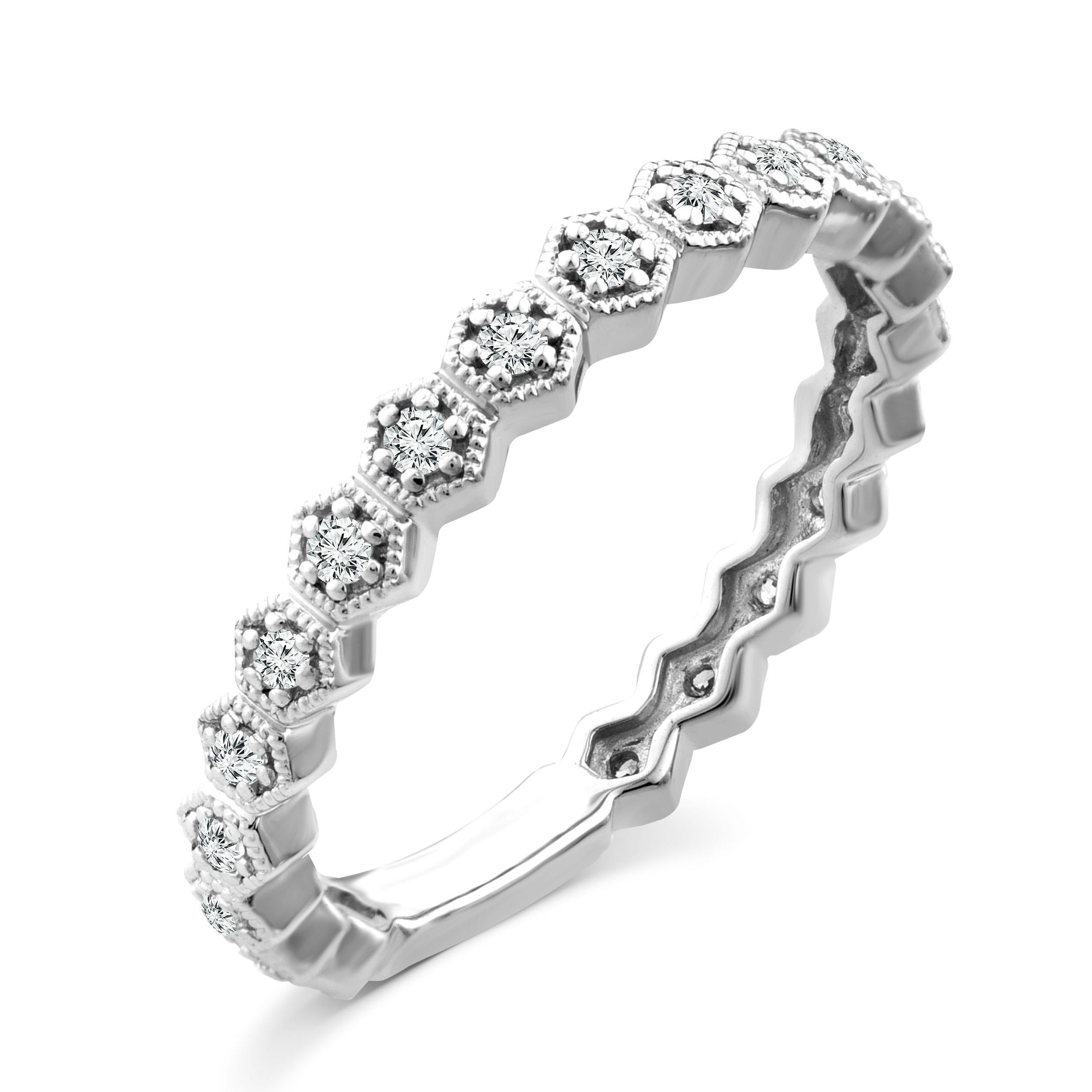 In trend with dainty and minimalistic jewelry, this romantic piece is the perfect stackable ring yet it's chic enough to wear as a standout. In addition to a stylish everyday wear, this diamond fashion band can also be worn as a unique wedding band,